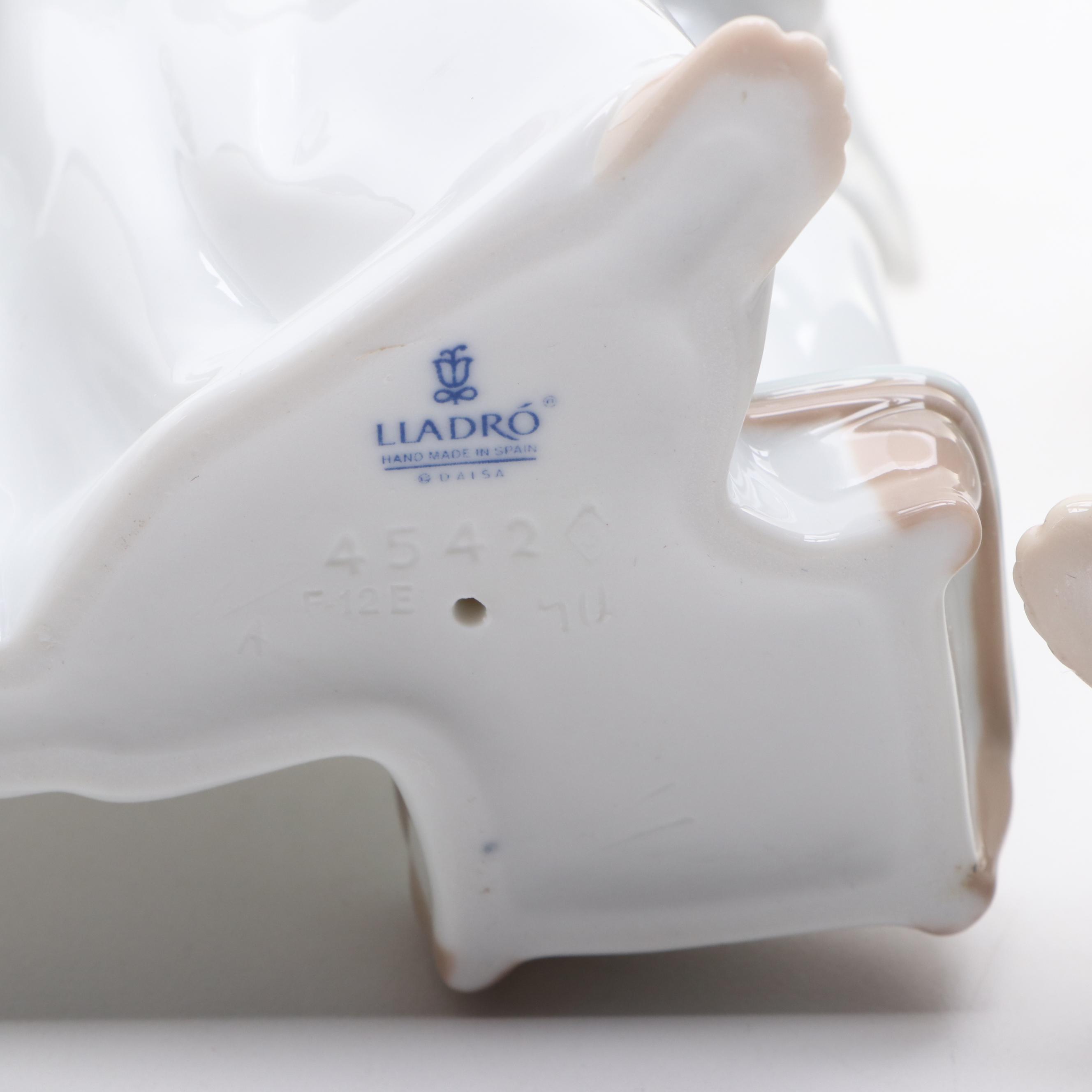 Lladró "Angels Group" and "Angel with Flute" Porcelain Figurines