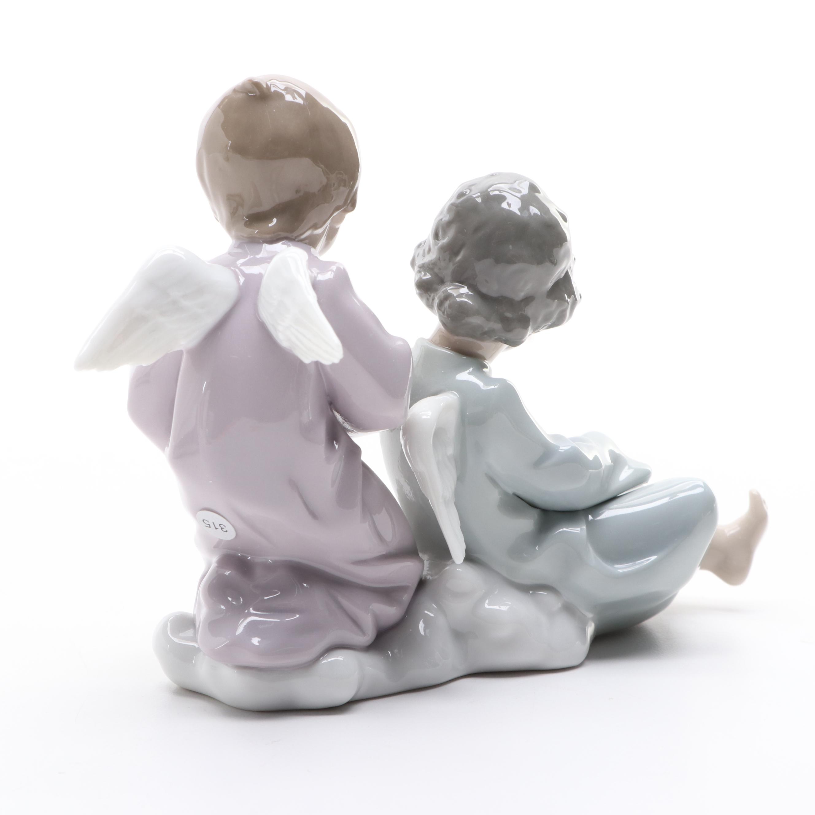 Lladró "Angelic Violinist" Tree Topper and "Angel Care" Porcelain Figurine
