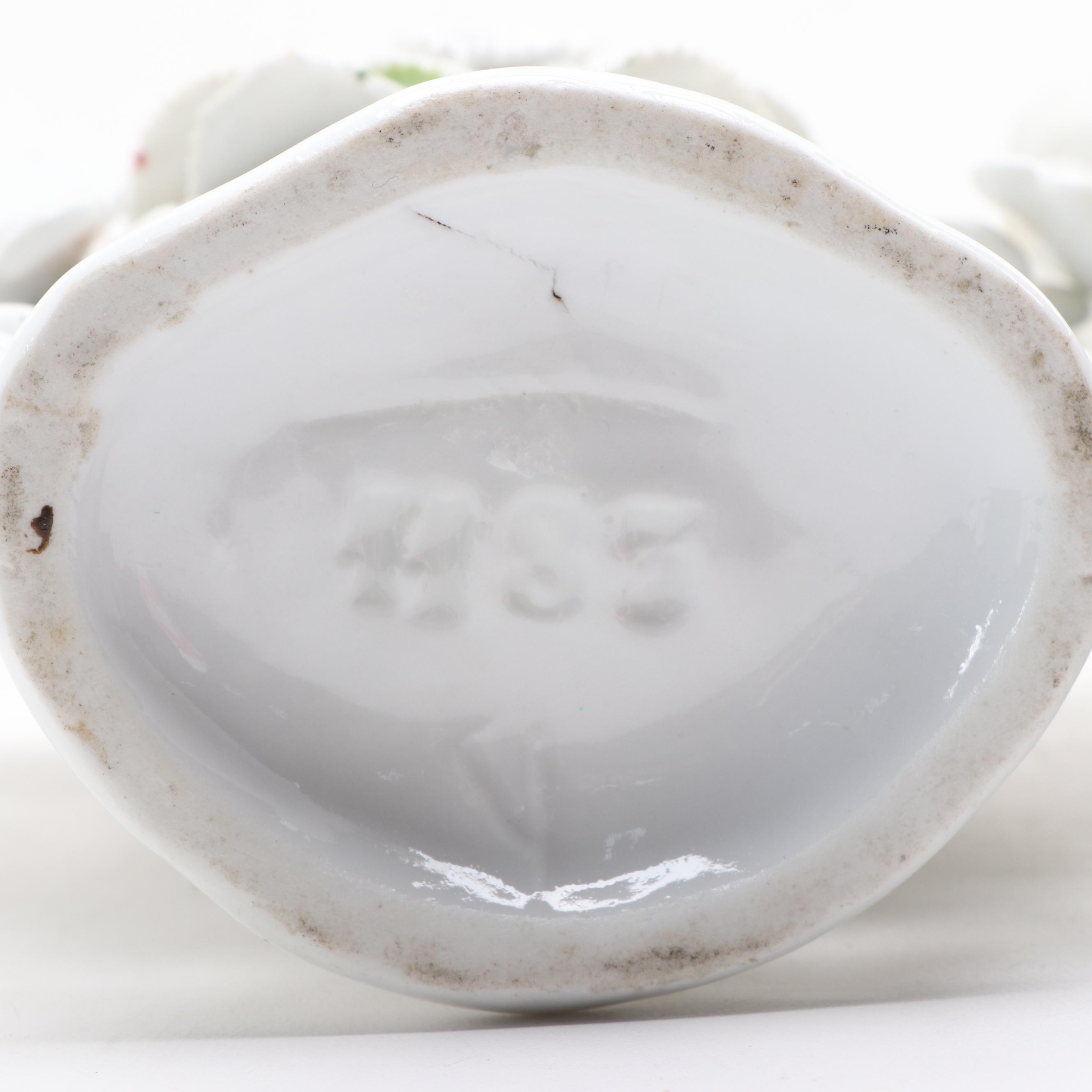 Painted Metal Rabbit Bookends with Floral Motif Porcelain Vase