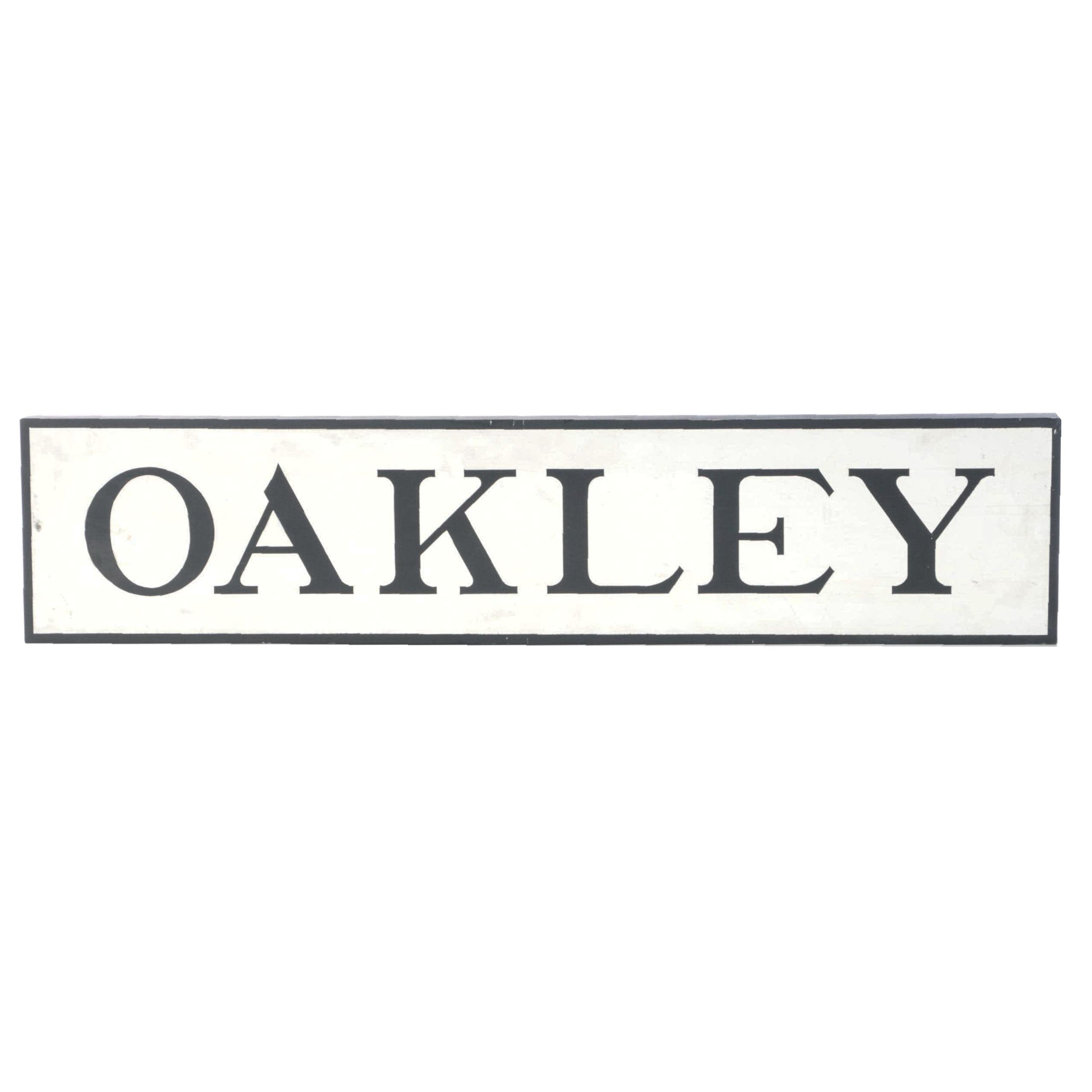 Oakley White and Black Wooden Sign