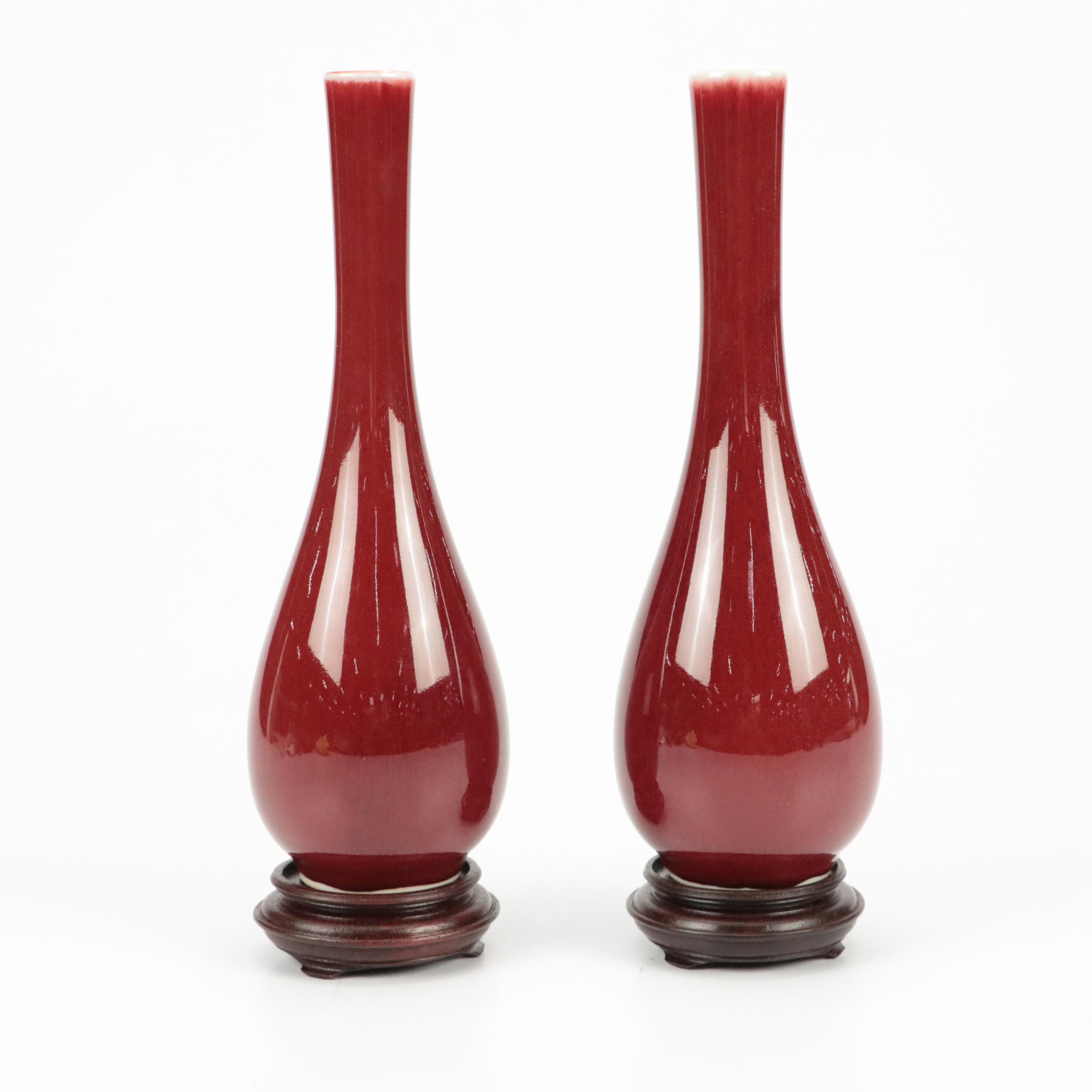 Japanese Sang de Boeuf Glazed Porcelain Vase on a Stand, Pair