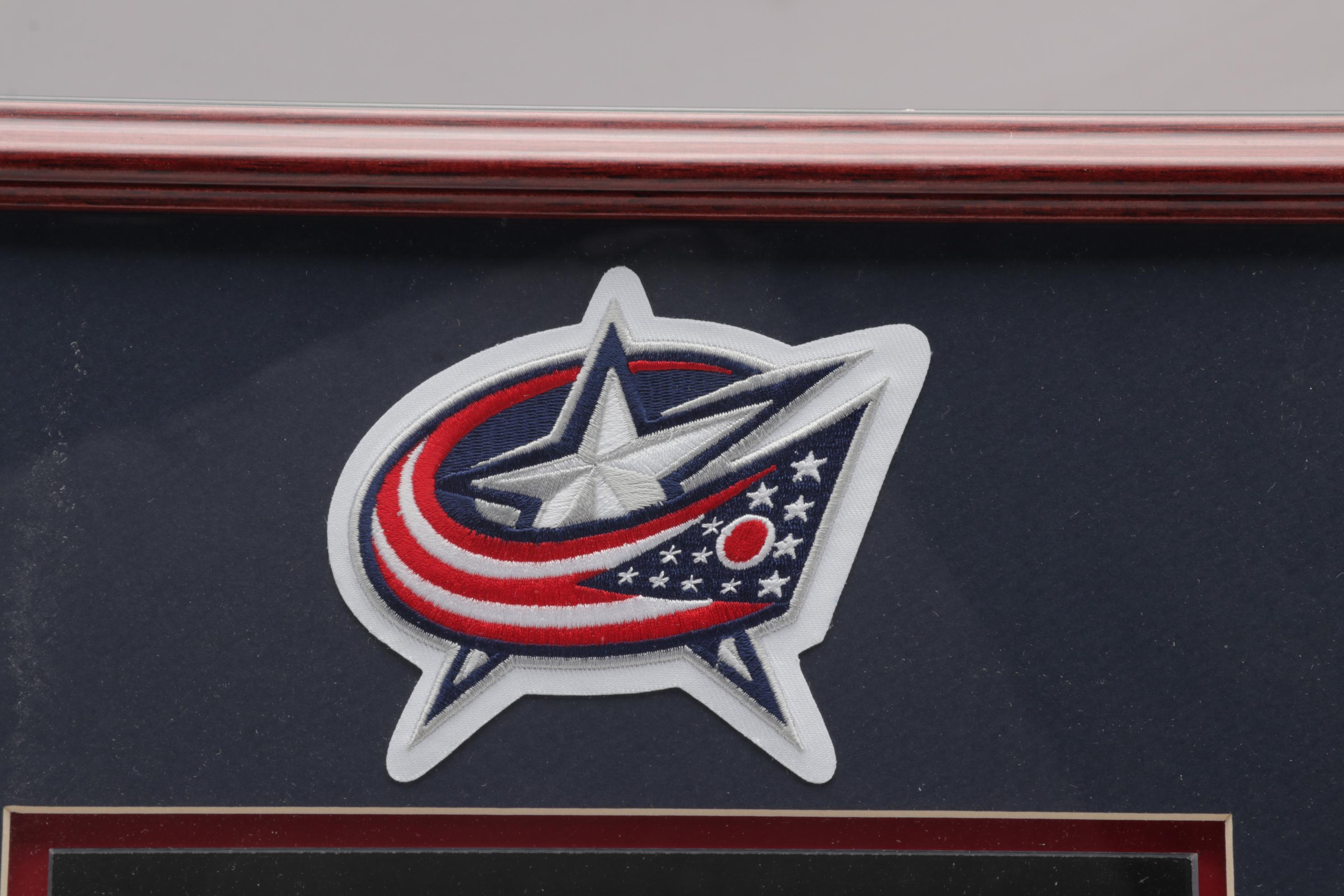 Columbus Blue Jackets Signed Helmet and Team Signed Framed Poster