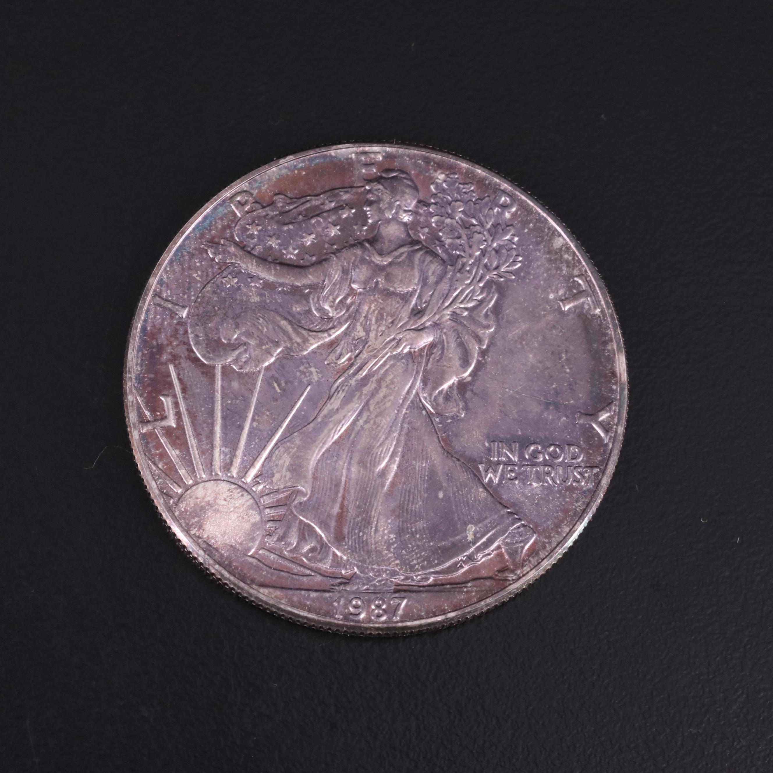 Small Collection of U.S. Coins With a 1987 Silver Eagle