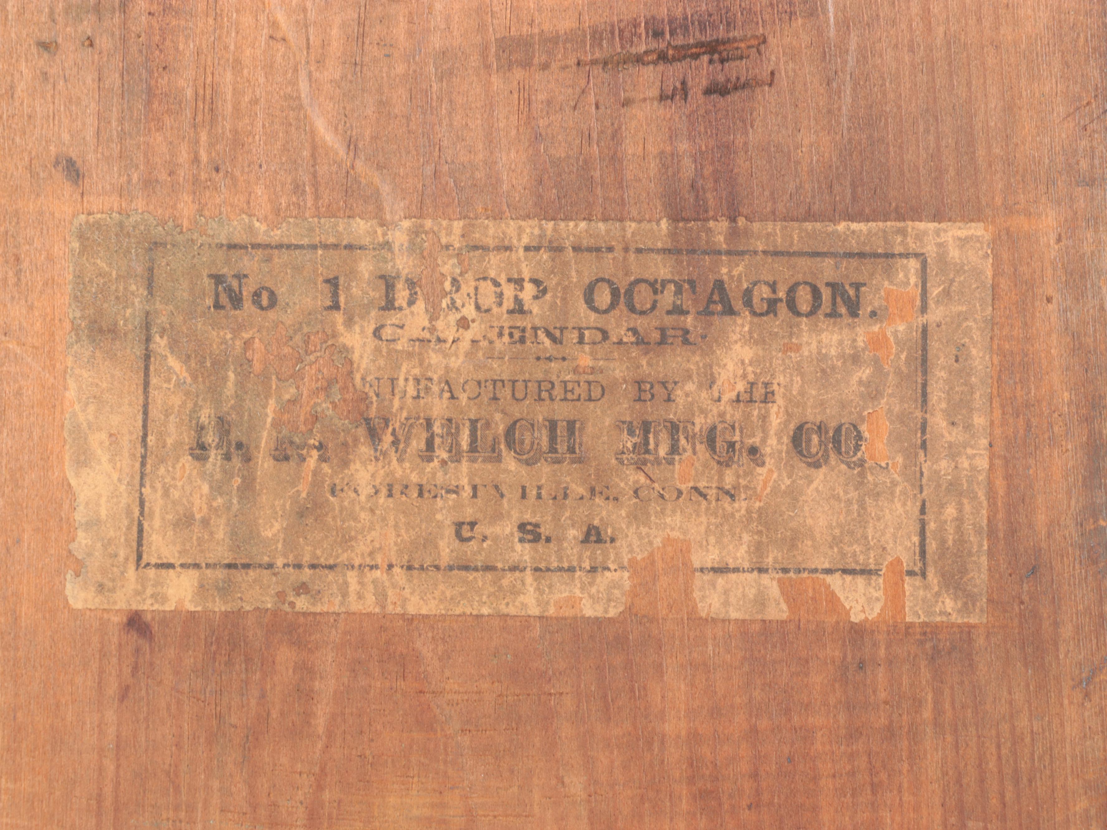 E. N. Welch Manufacturing Co. Wood Octagon Regulator Wall Clock
