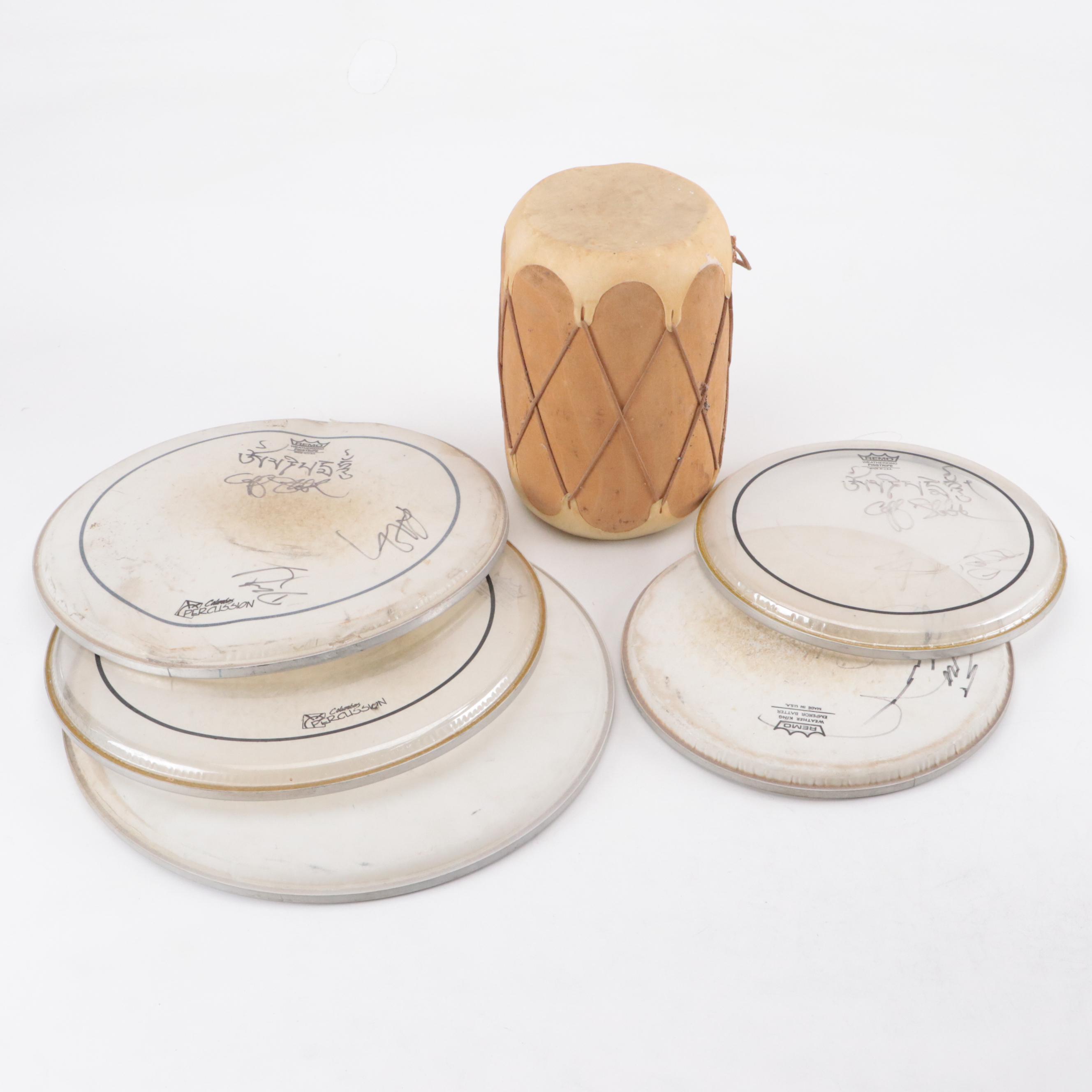 Autographed and More Remo Drum Heads With Hide Covered Wooden Drum
