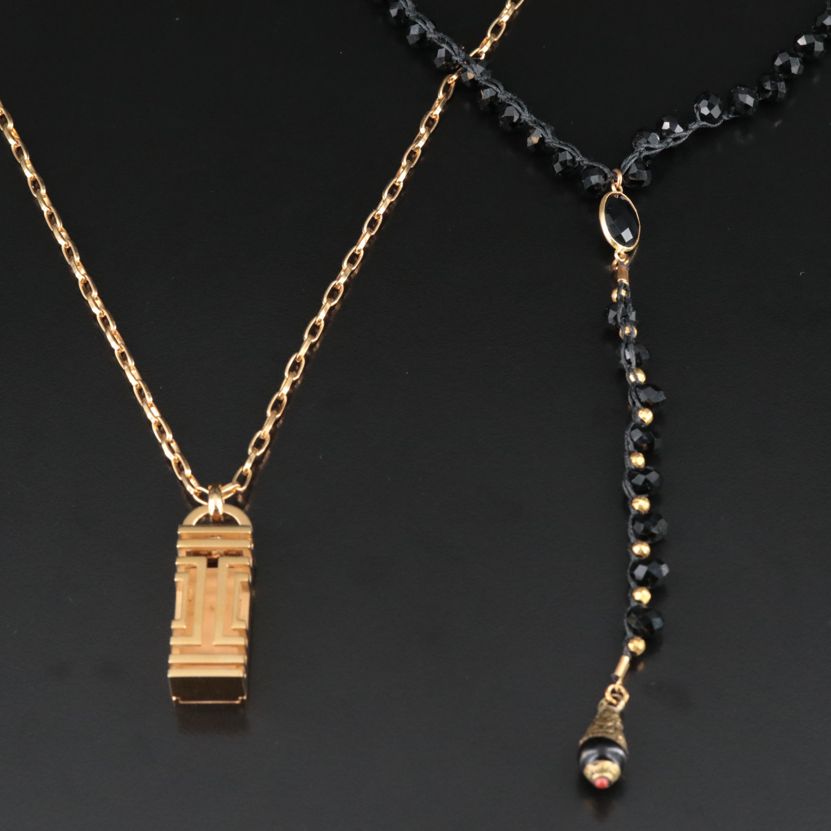 An Old Soul Crocheted Crystal Necklace and a Tory Burch Necklace for Fitbit