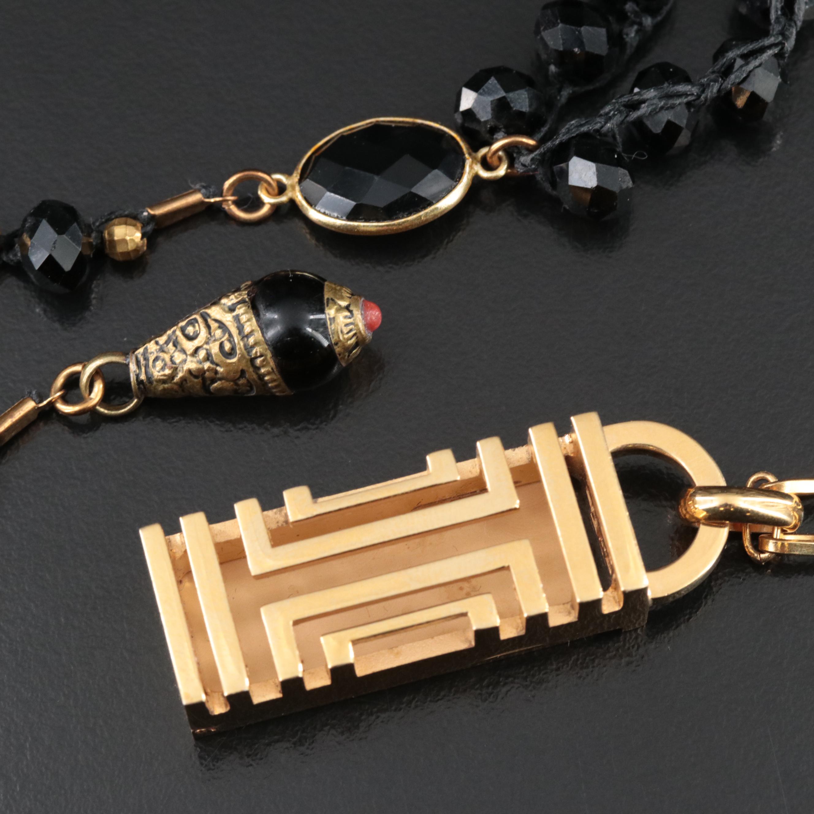 An Old Soul Crocheted Crystal Necklace and a Tory Burch Necklace for Fitbit