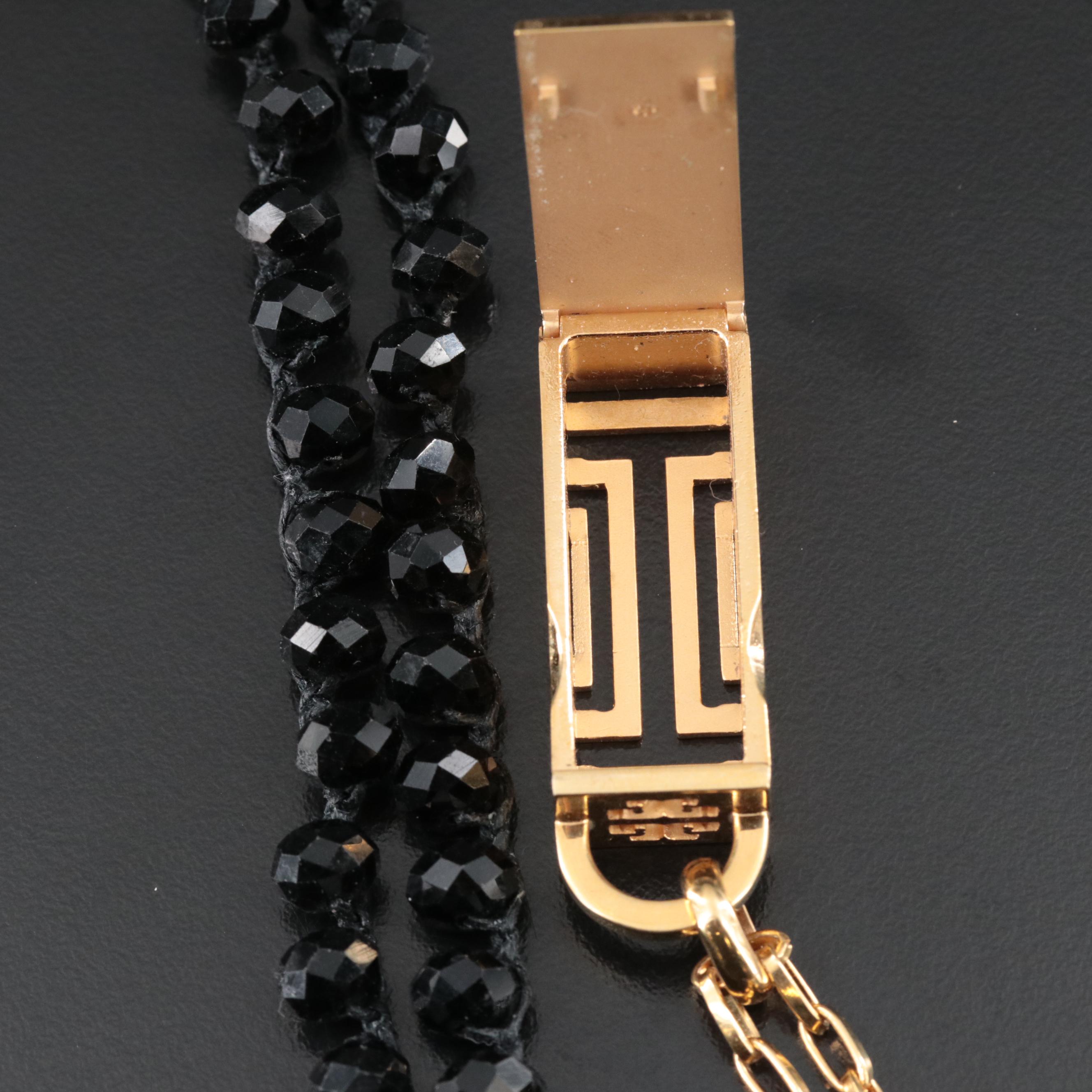 An Old Soul Crocheted Crystal Necklace and a Tory Burch Necklace for Fitbit