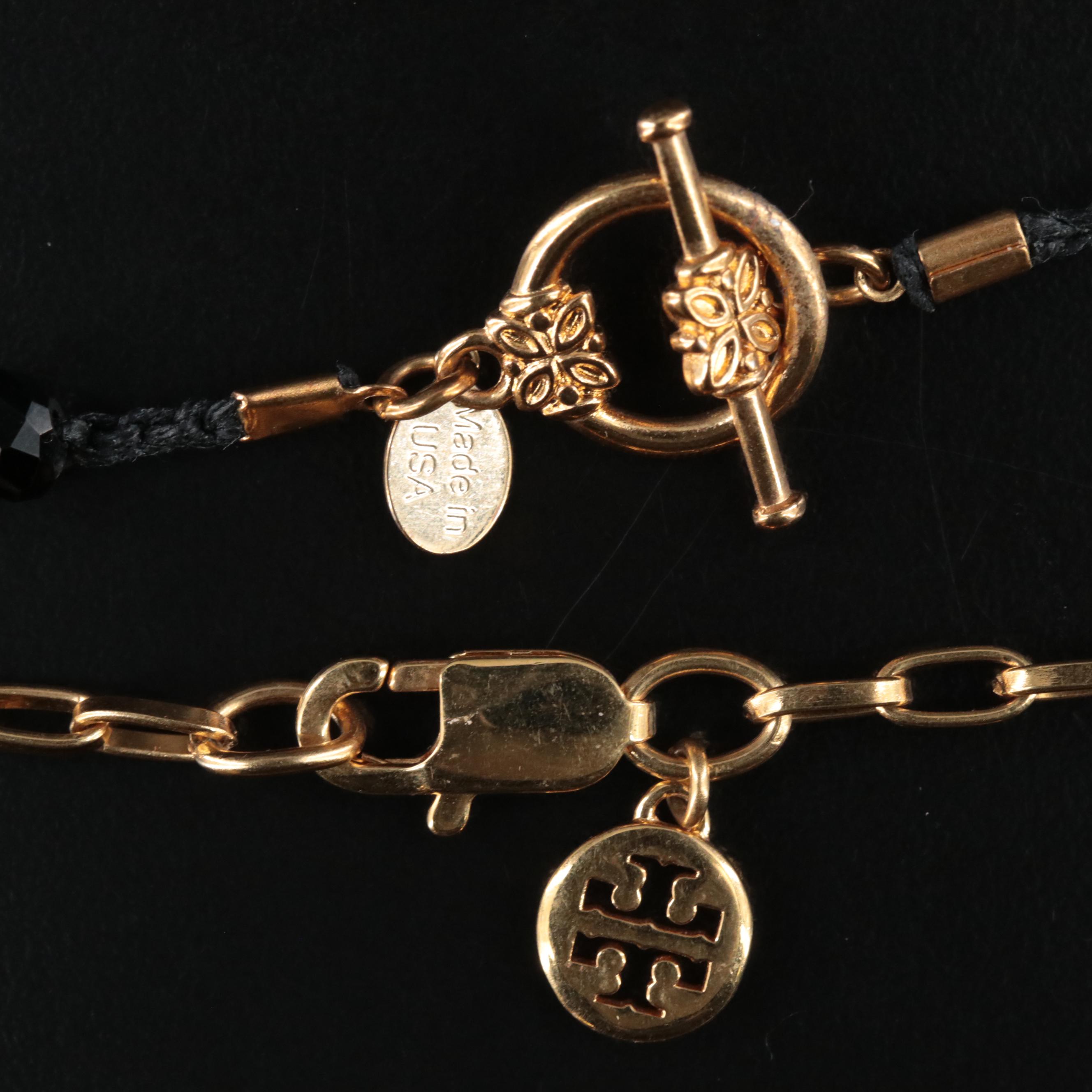 An Old Soul Crocheted Crystal Necklace and a Tory Burch Necklace for Fitbit