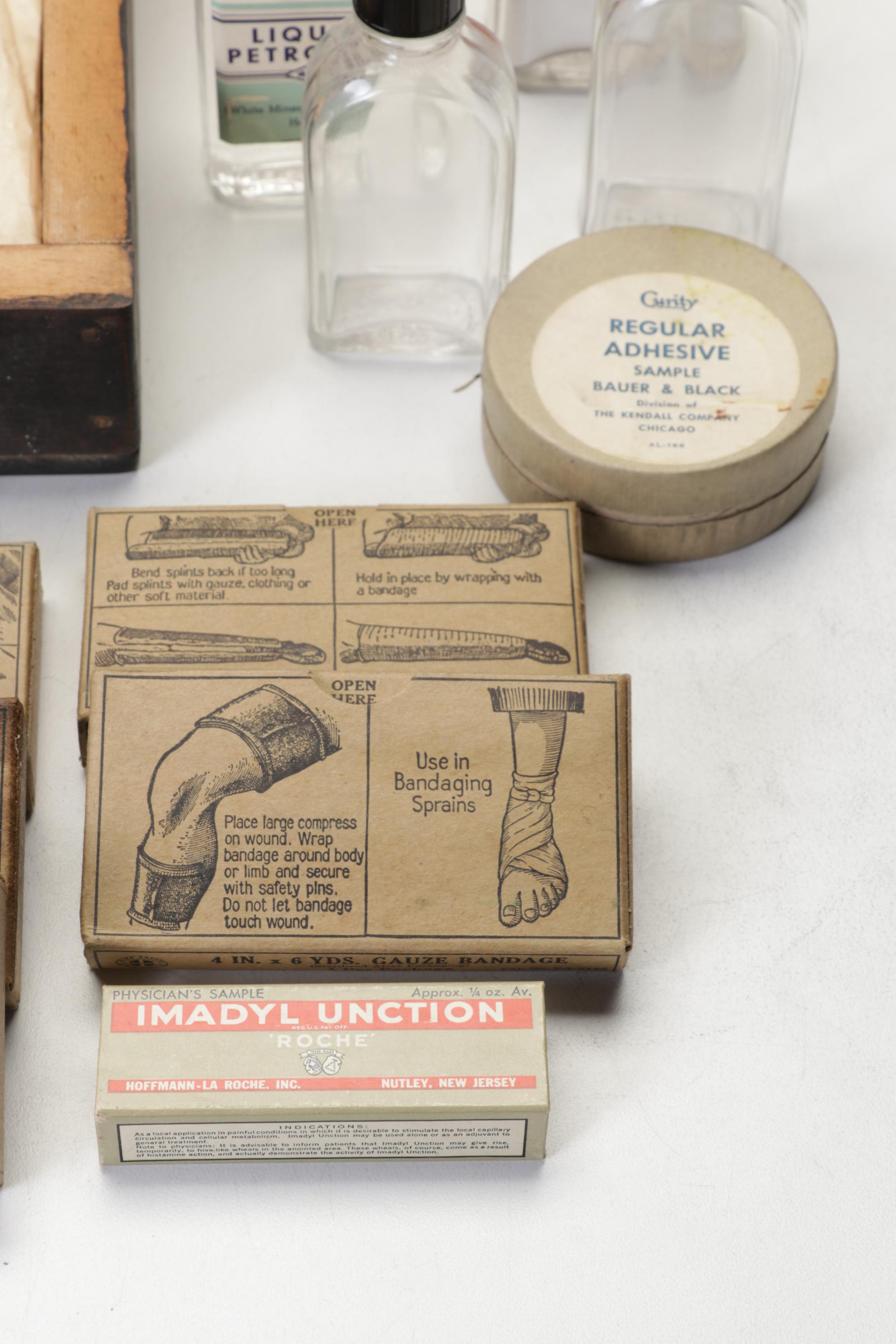 WWII First Aid Supplies with Wooden Case and U.S. Civil Defense Manuals