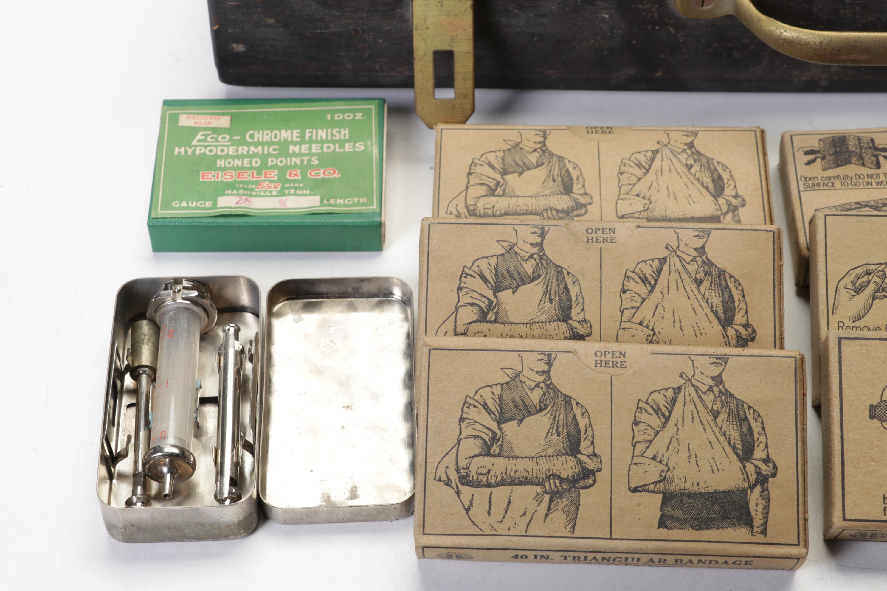 WWII First Aid Supplies with Wooden Case and U.S. Civil Defense Manuals