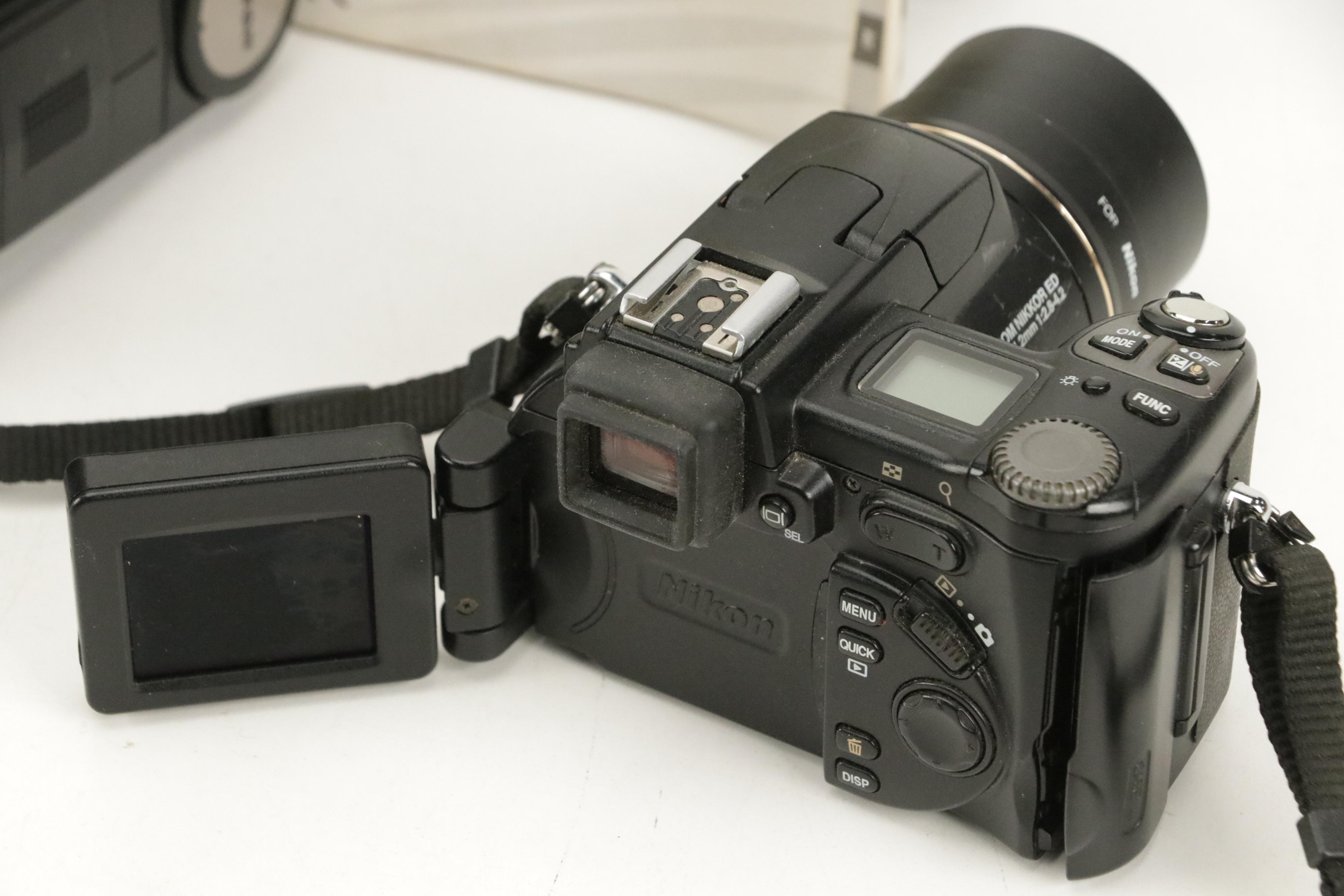 Nikon "Coolpix 8700" SLR Camera and Samsung "S630" Digital Camera with More