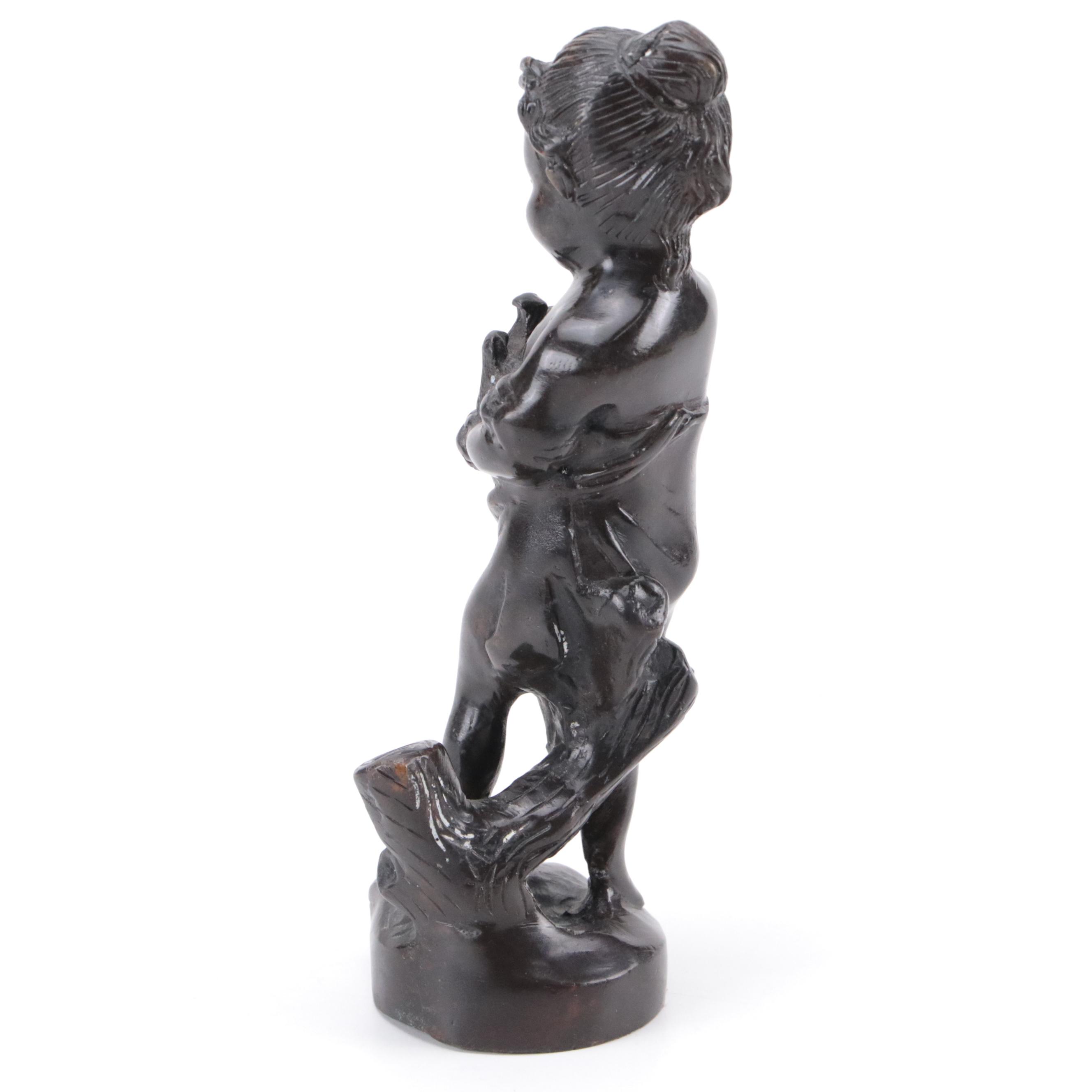 Bronze Sculpture of a Child Holding Birds