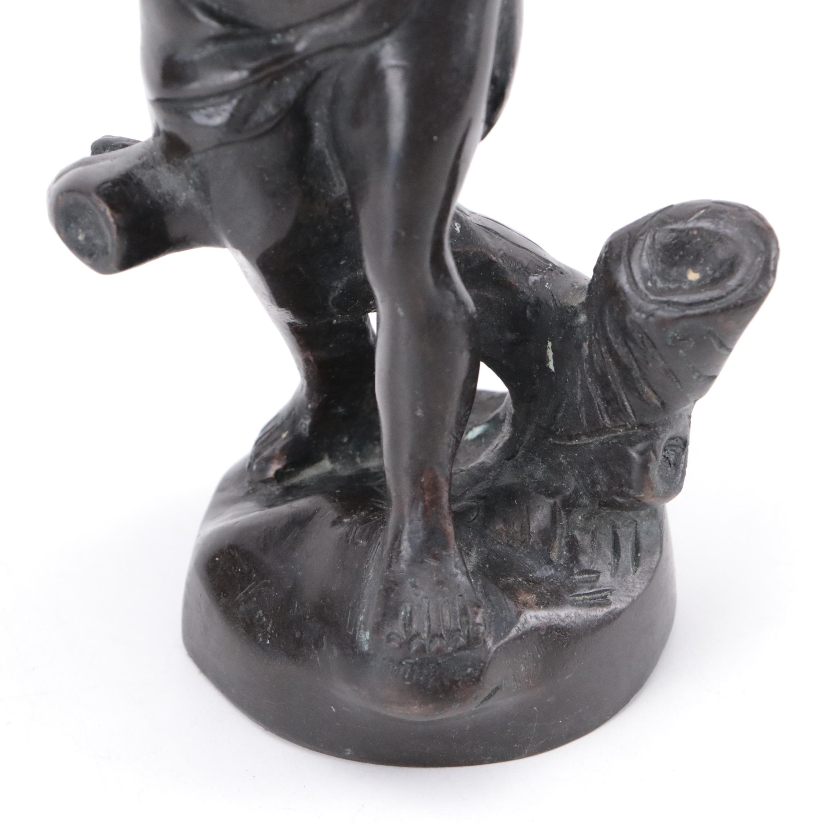 Bronze Sculpture of a Child Holding Birds