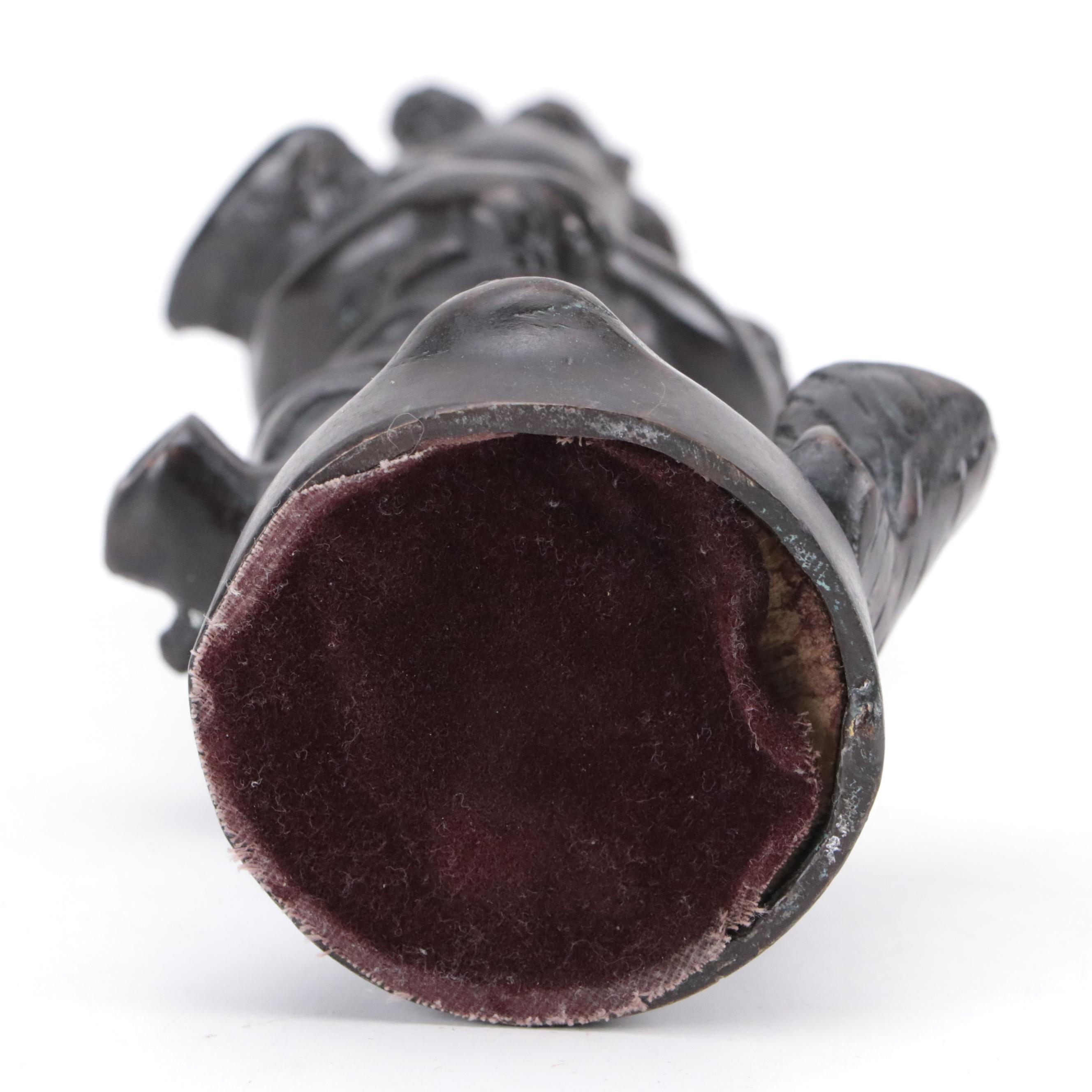 Bronze Sculpture of a Child Holding Birds