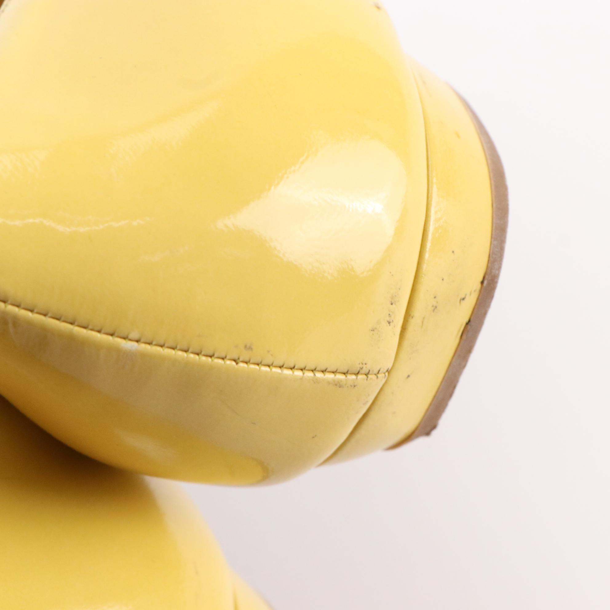 Prada Criss-Cross Detail Flats in Yellow Patent Leather