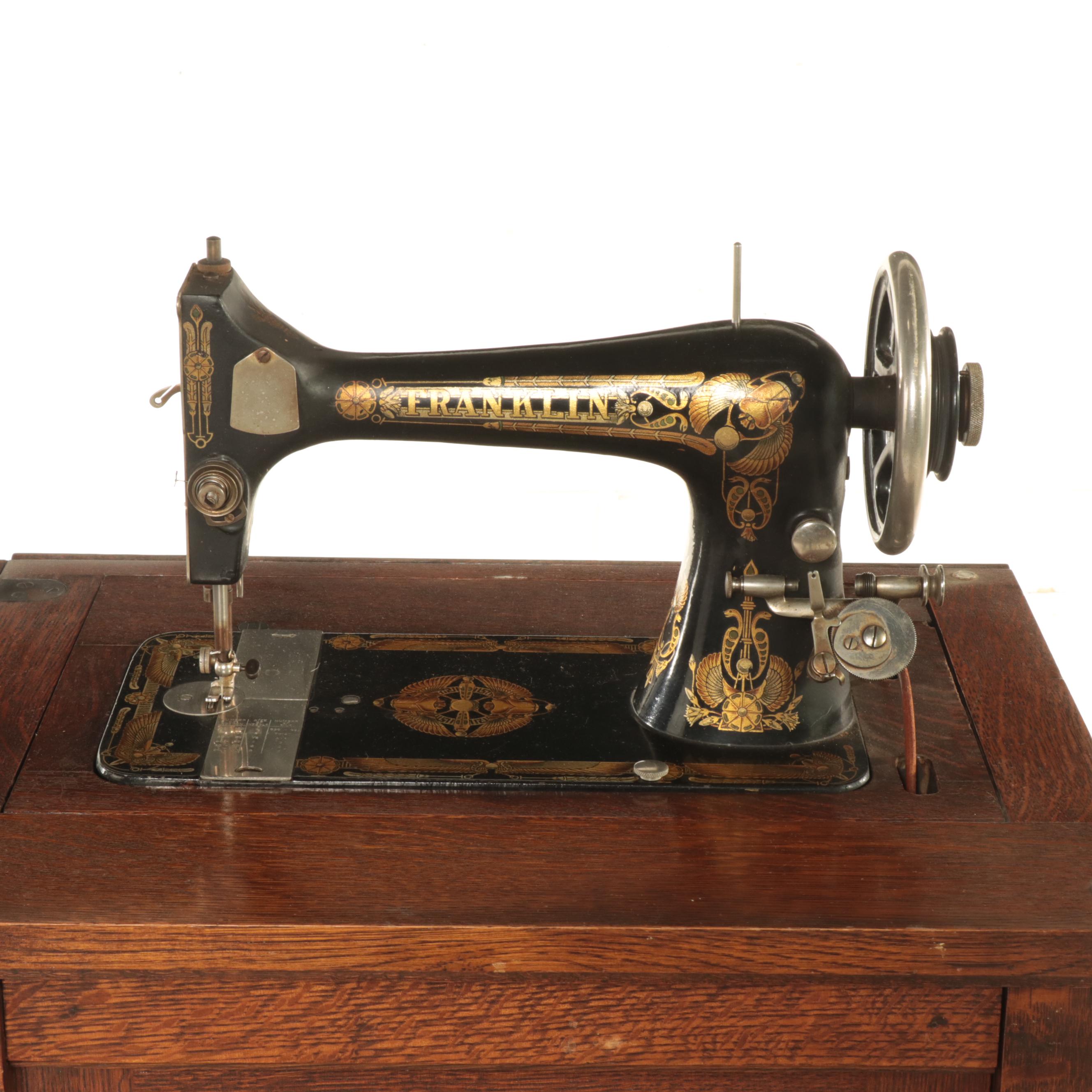 Franklin Egyptian Revival Decorated Treadle Sewing Machine in Oak Cabinet