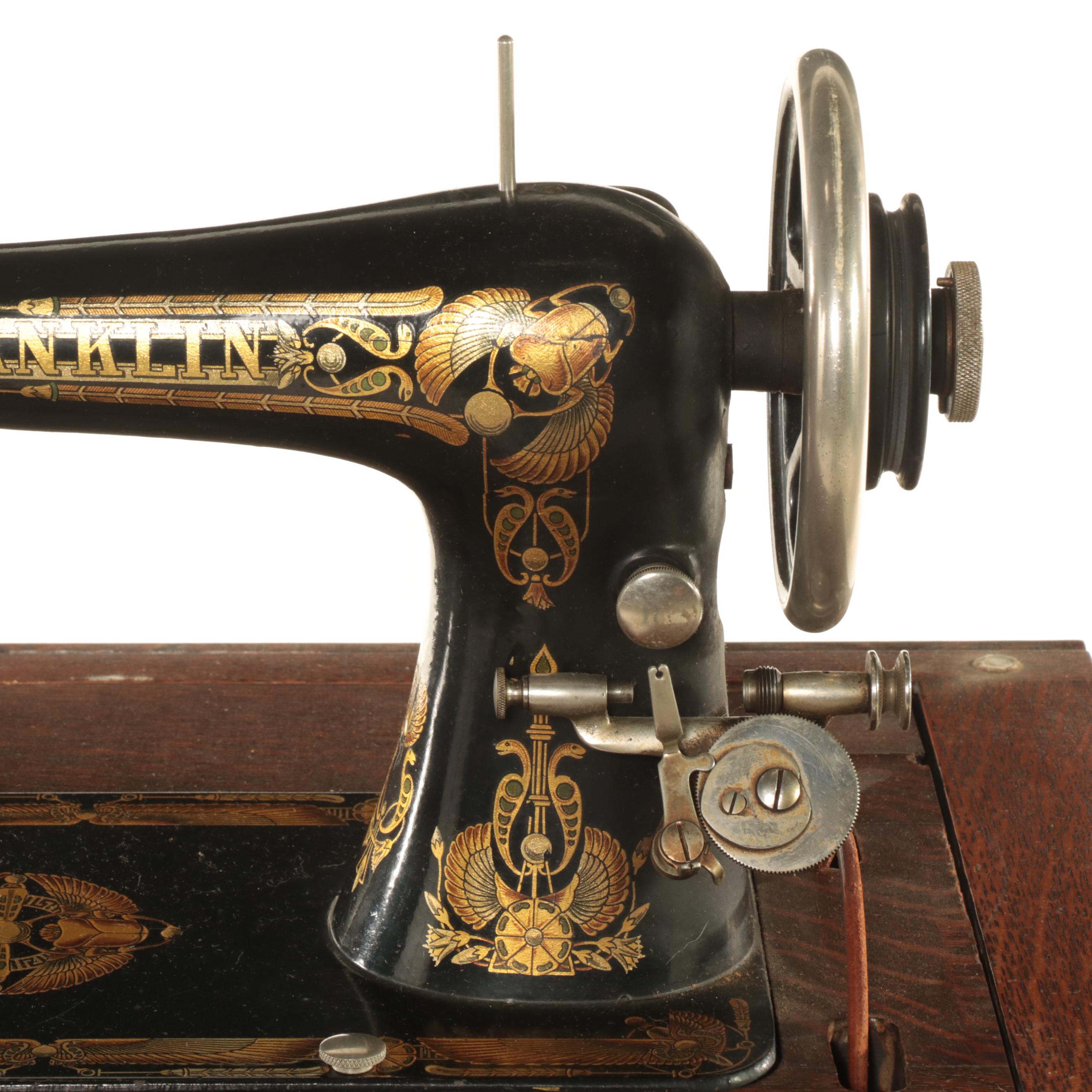 Franklin Egyptian Revival Decorated Treadle Sewing Machine in Oak Cabinet