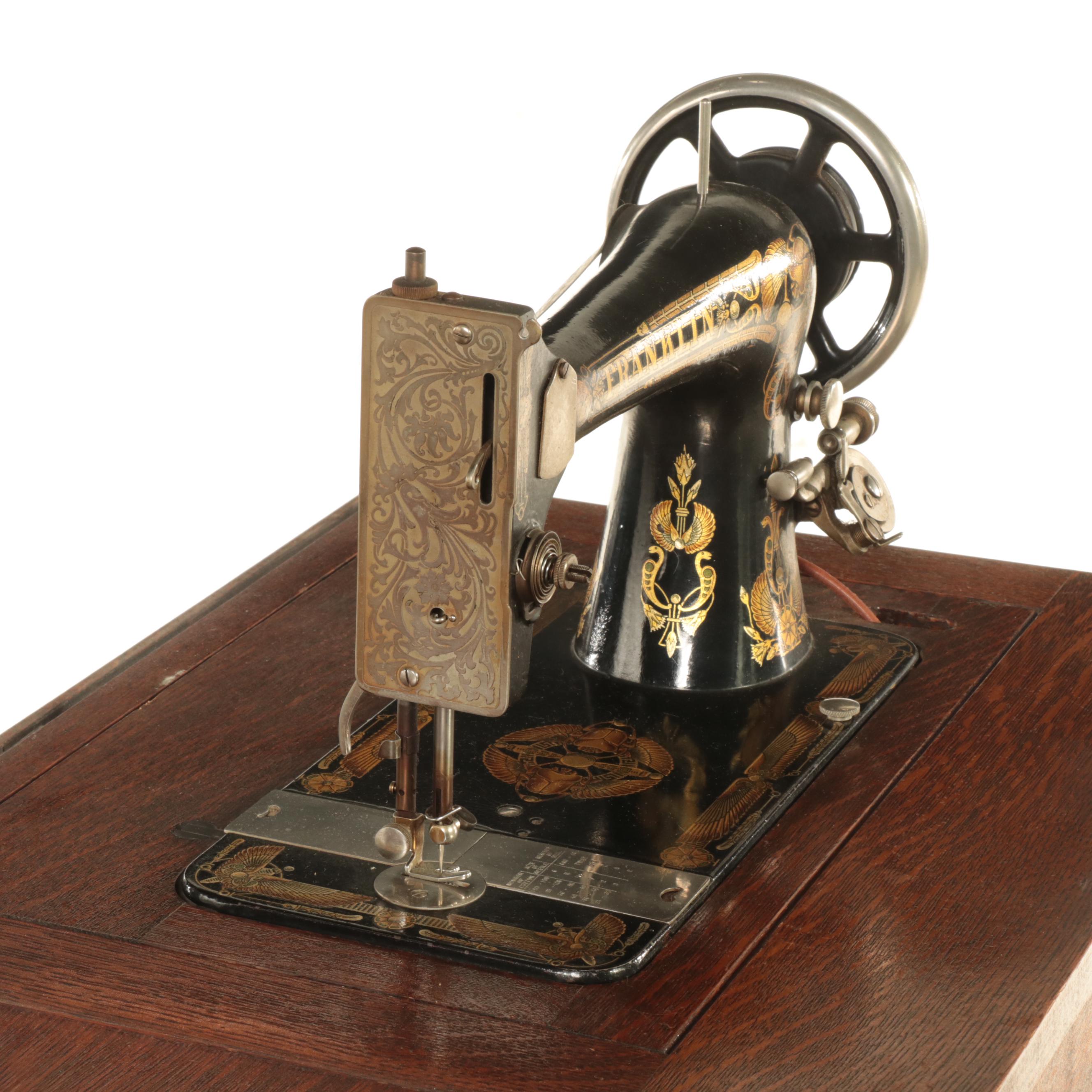 Franklin Egyptian Revival Decorated Treadle Sewing Machine in Oak Cabinet