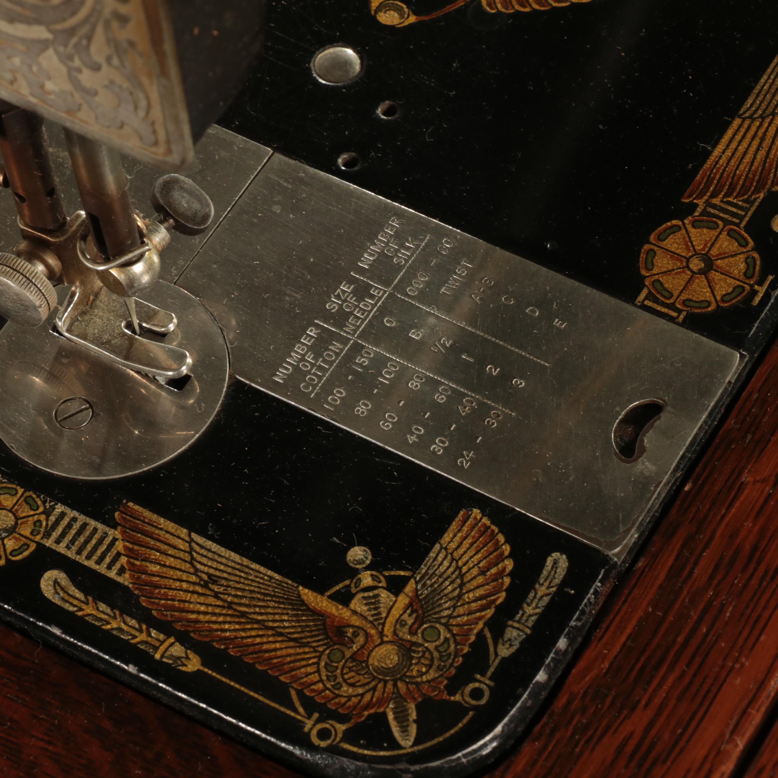 Franklin Egyptian Revival Decorated Treadle Sewing Machine in Oak Cabinet