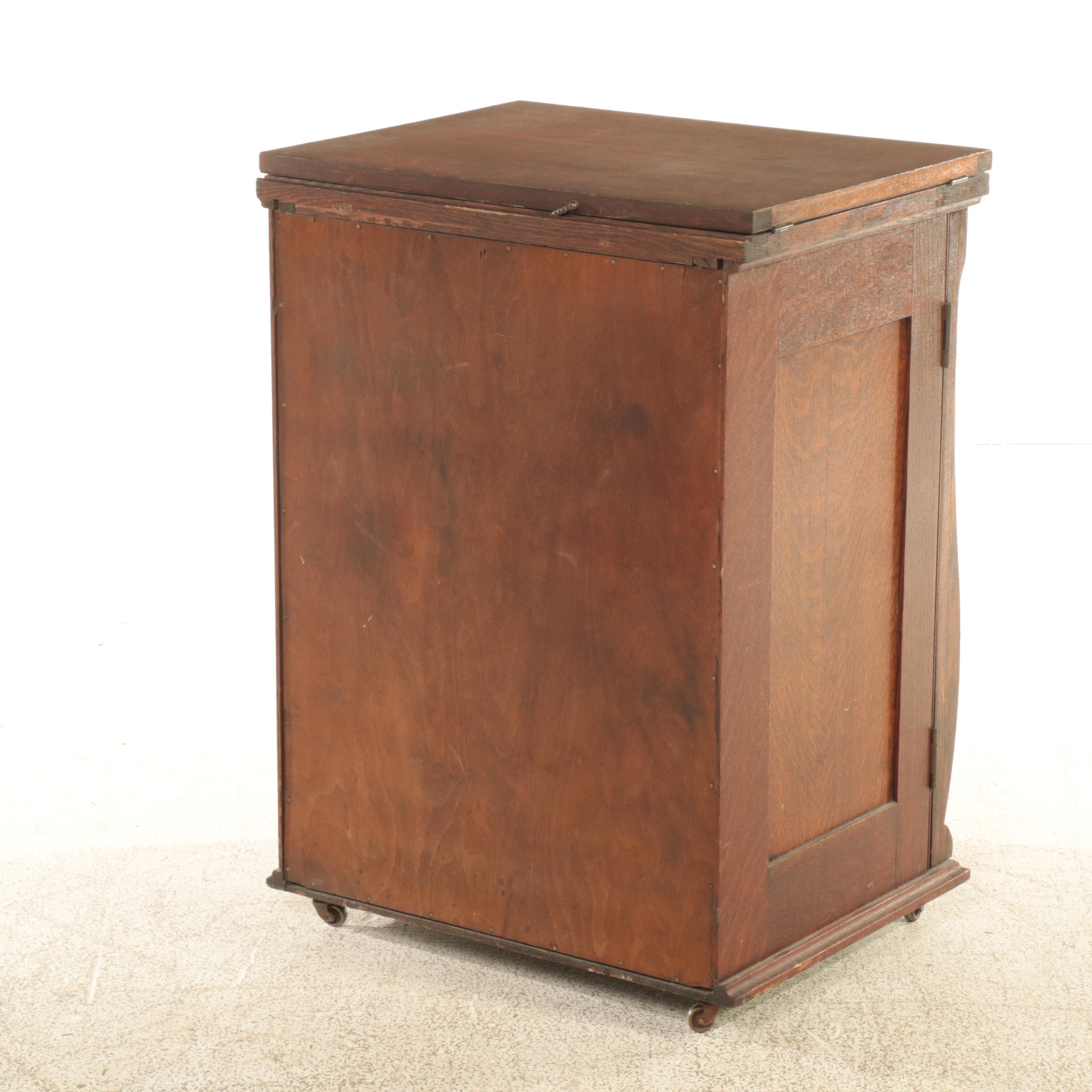 Franklin Egyptian Revival Decorated Treadle Sewing Machine in Oak Cabinet