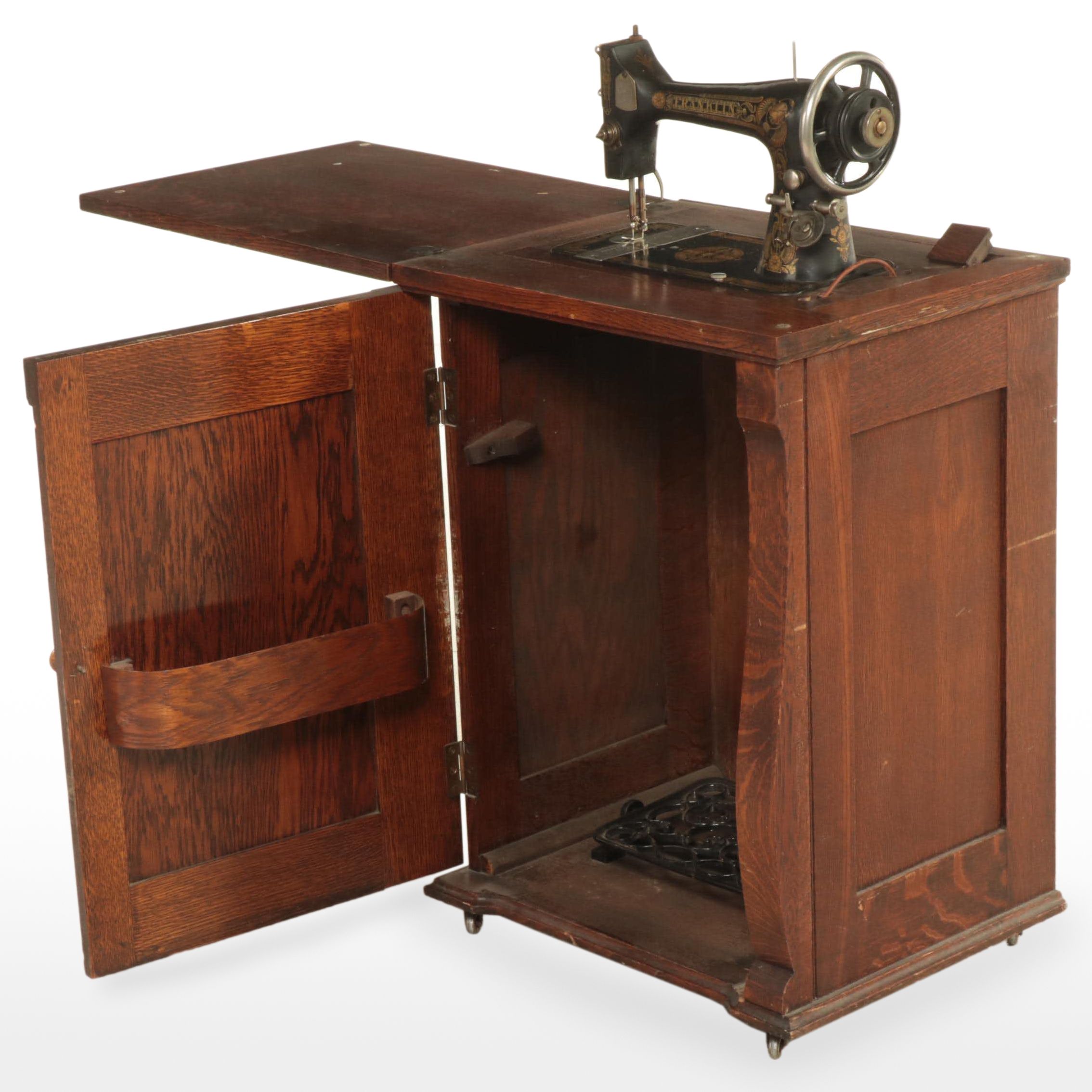 Franklin Egyptian Revival Decorated Treadle Sewing Machine in Oak Cabinet