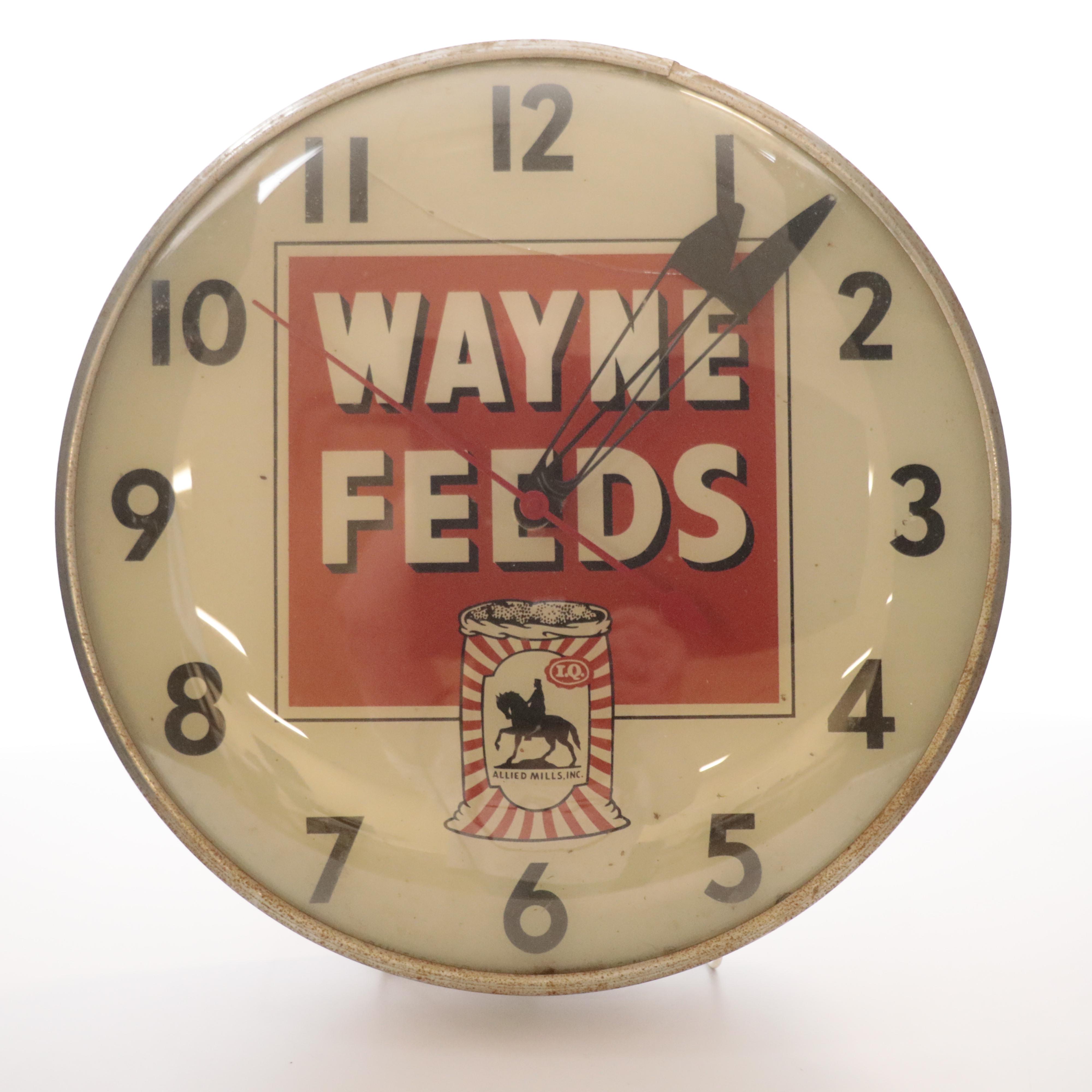 Pam Clock Co. Illuminated "Wayne Feeds" Wall Clock, Mid-20th Century Clocks
