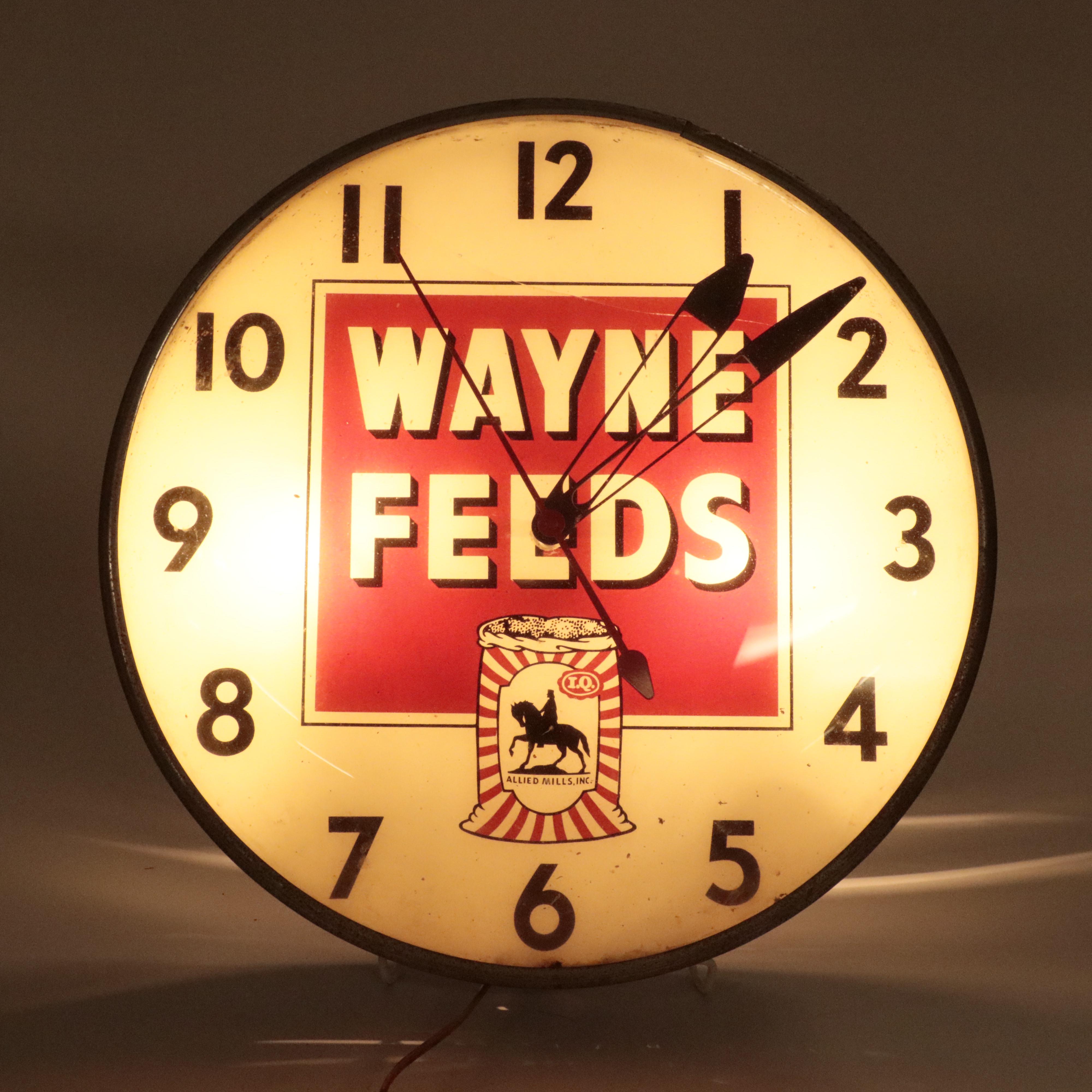 Pam Clock Co. Illuminated "Wayne Feeds" Wall Clock, Mid-20th Century Clocks