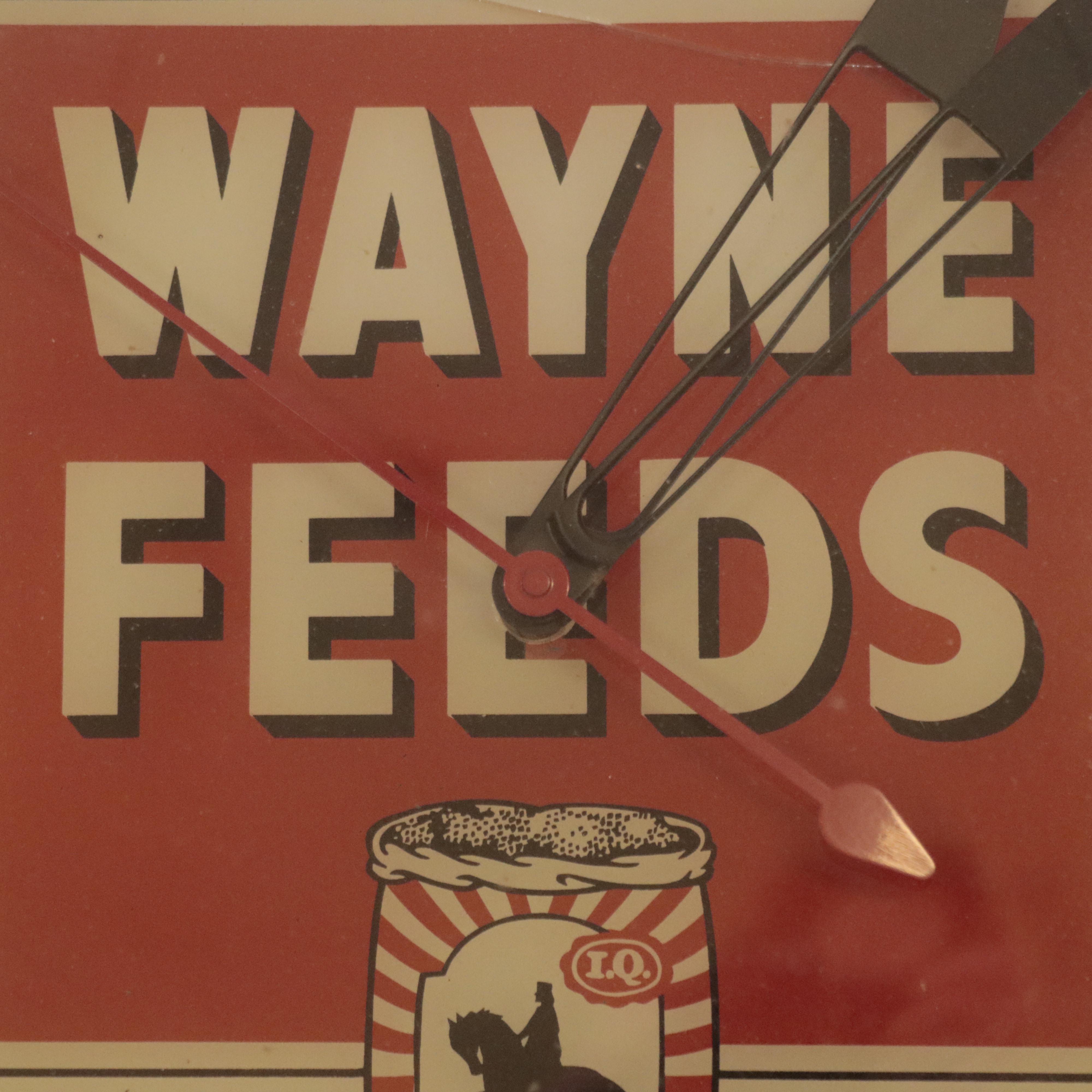 Pam Clock Co. Illuminated "Wayne Feeds" Wall Clock, Mid-20th Century Clocks