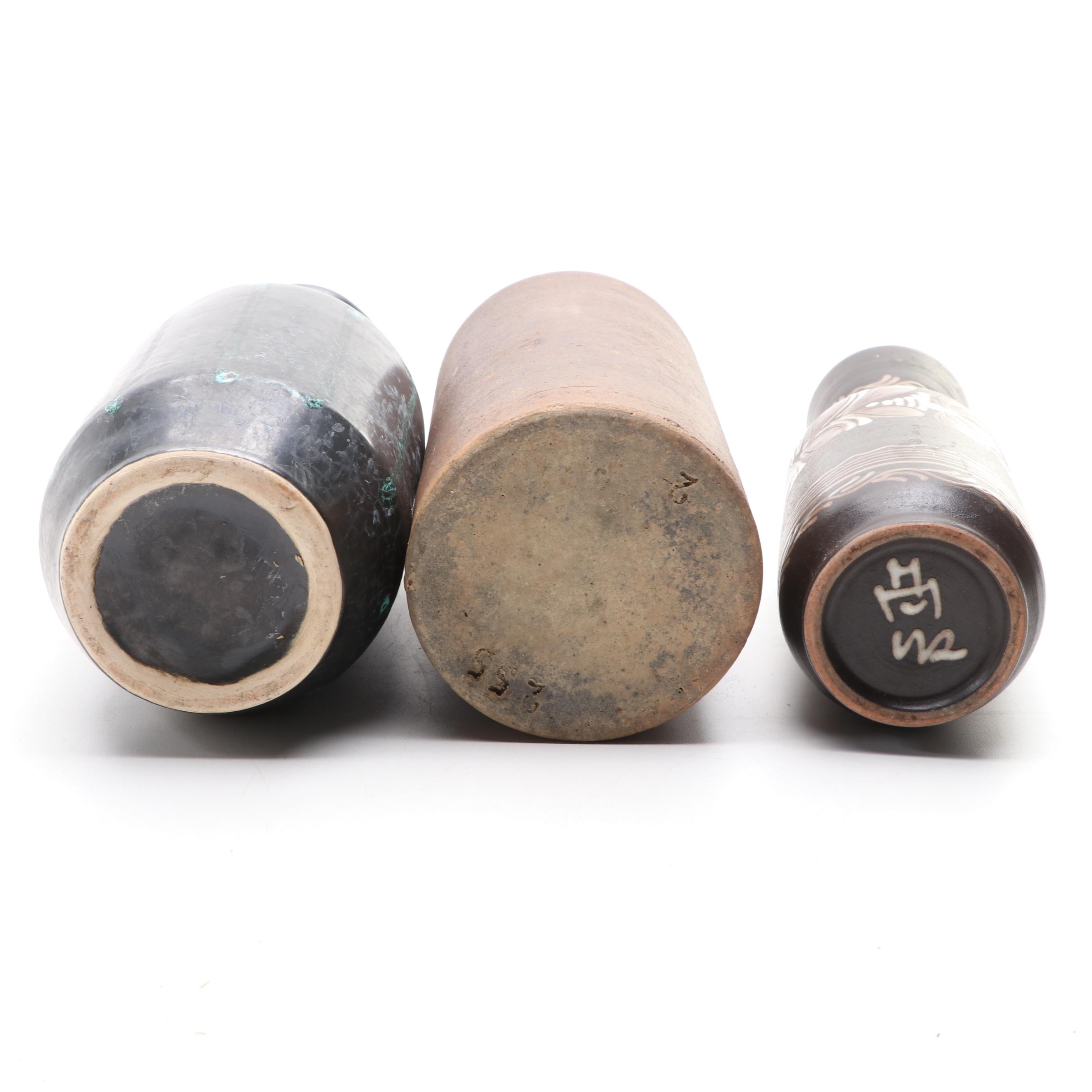 Bottle Form Vase with Other Glazed Vases and Planters