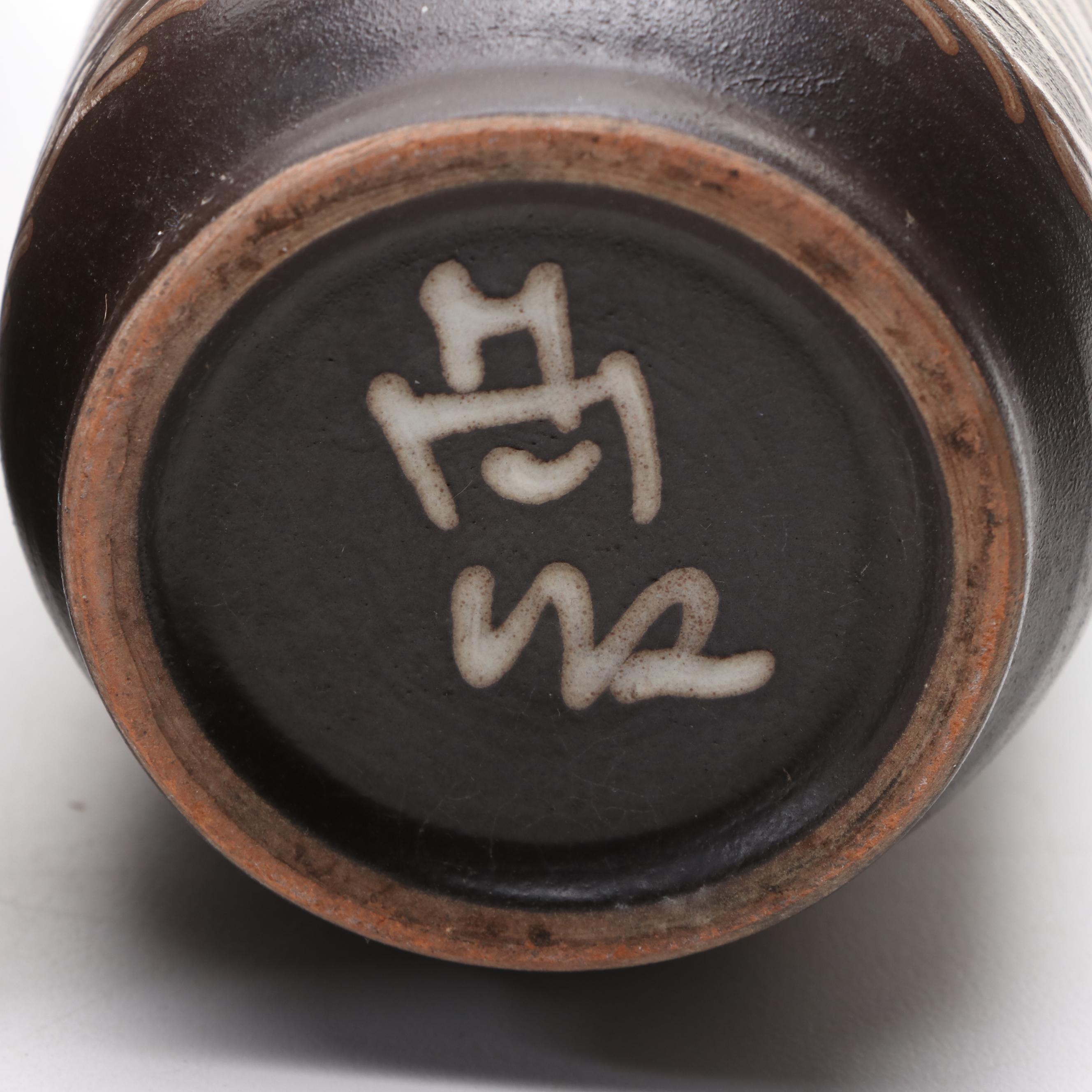 Bottle Form Vase with Other Glazed Vases and Planters