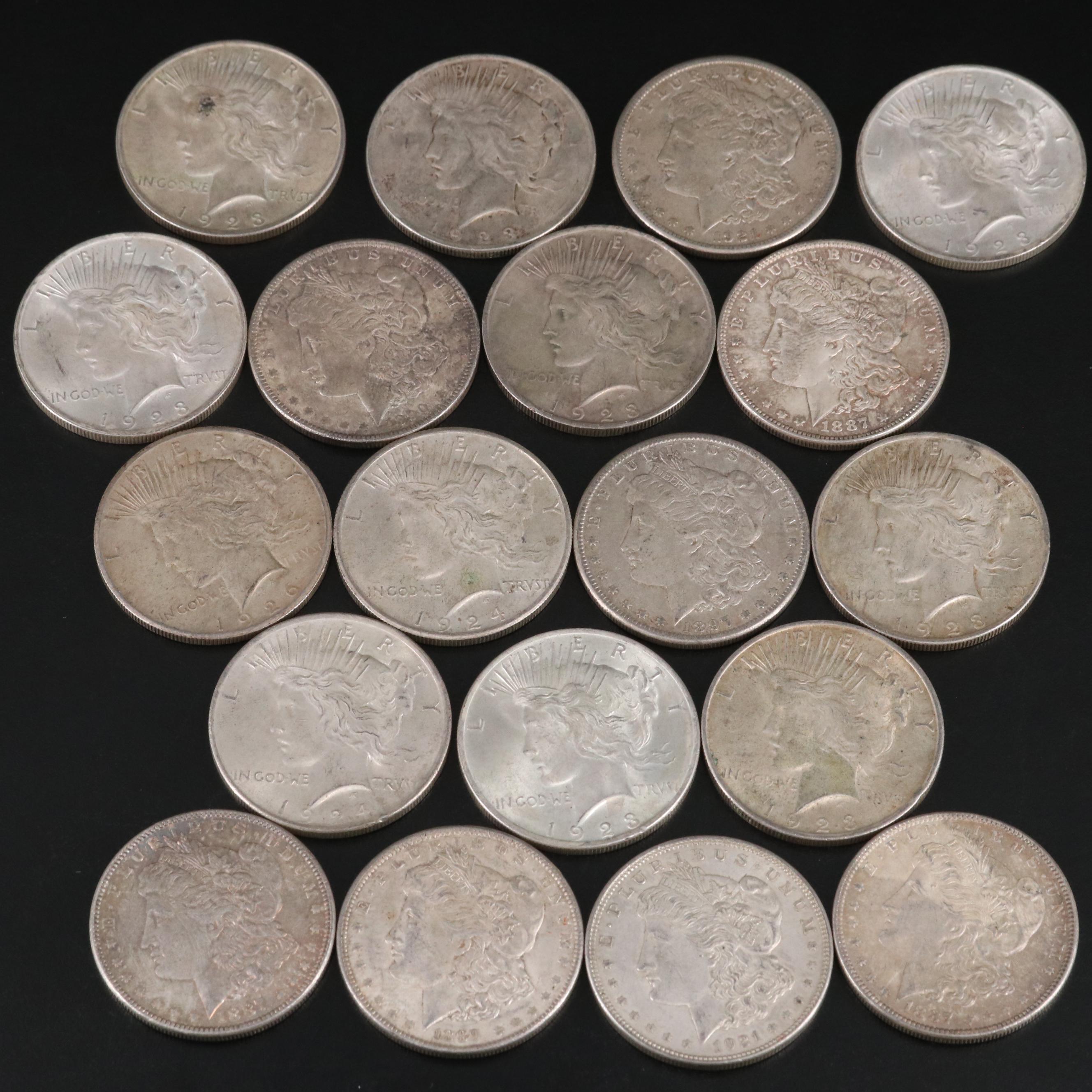 Nineteen Morgan and Peace Silver Dollars