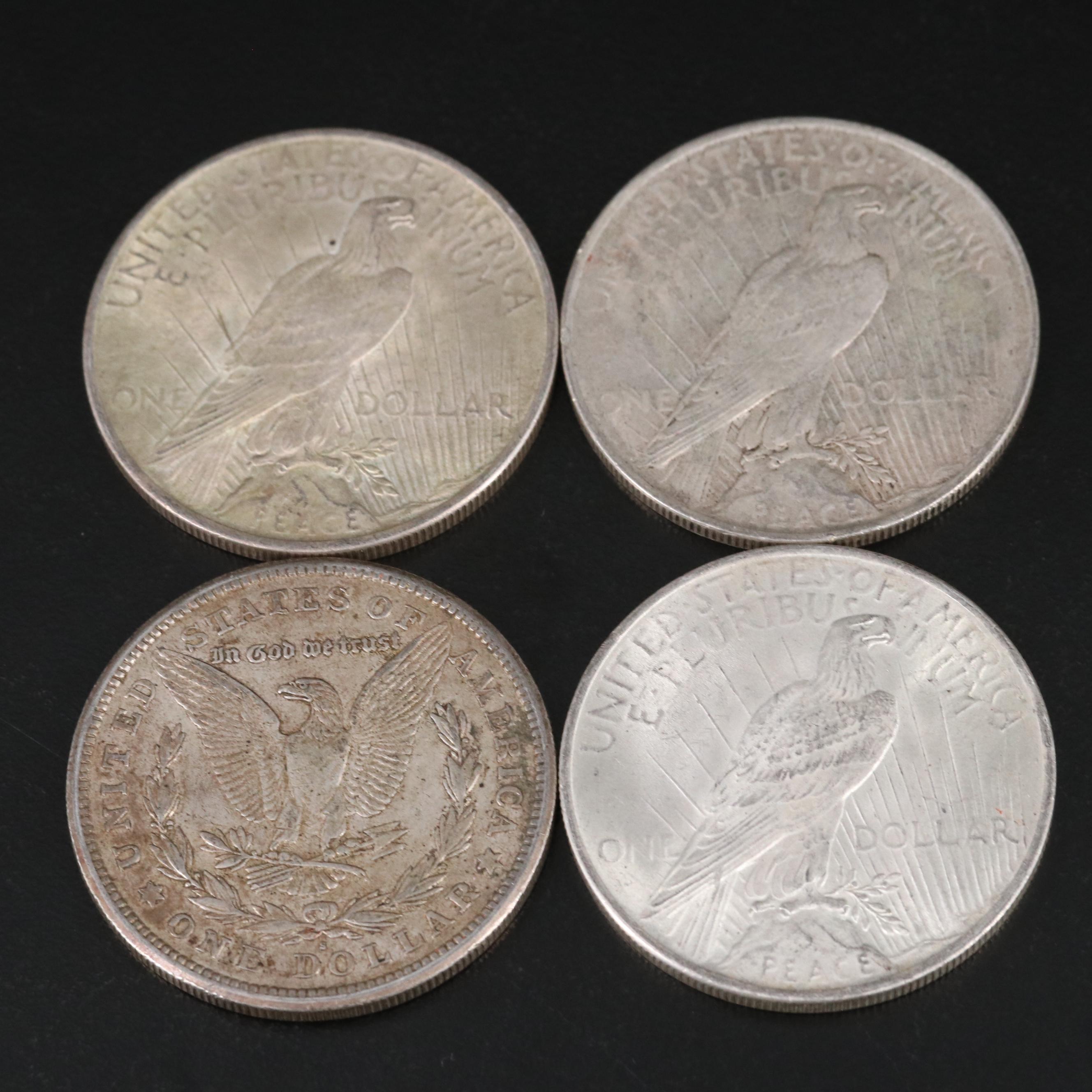 Nineteen Morgan and Peace Silver Dollars