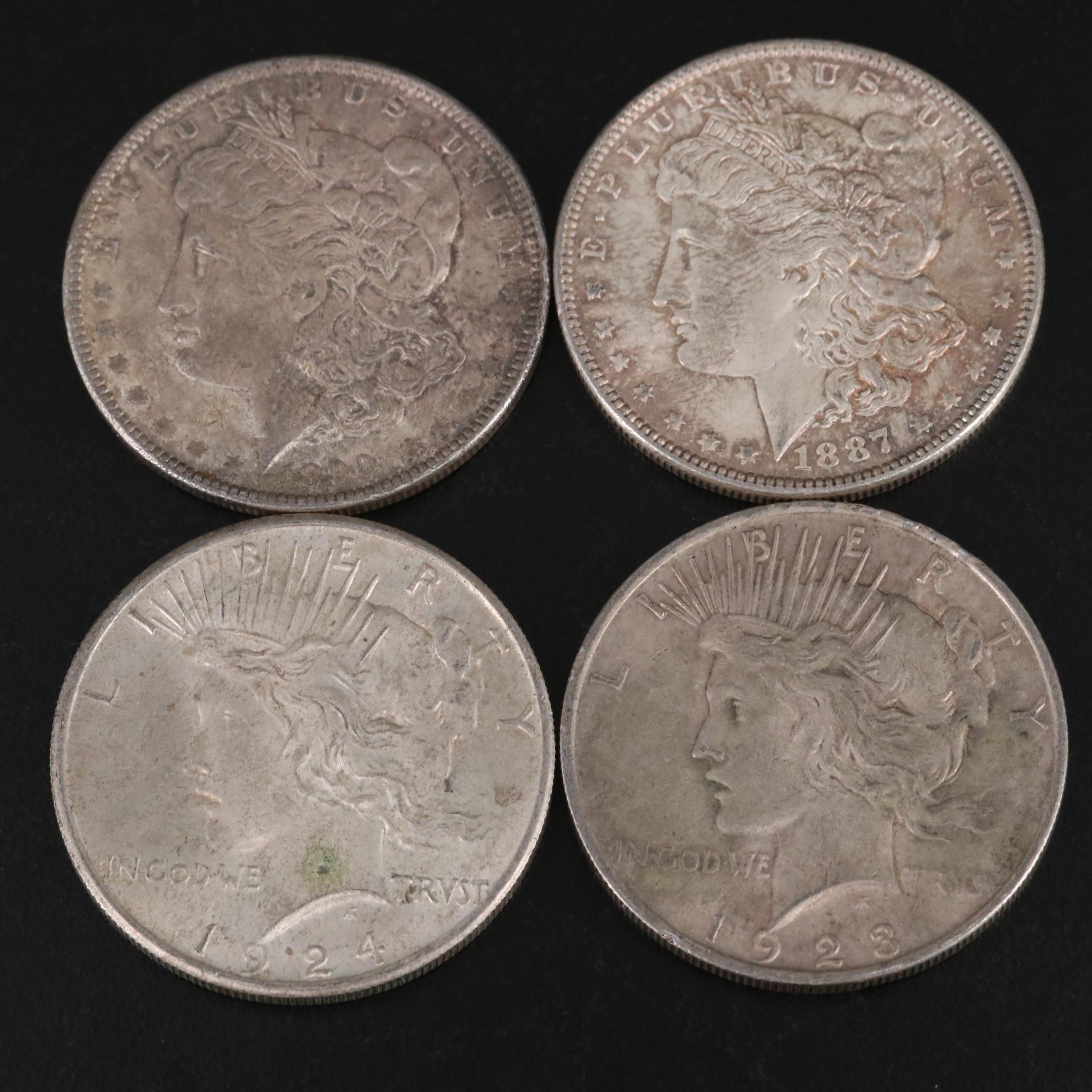 Nineteen Morgan and Peace Silver Dollars