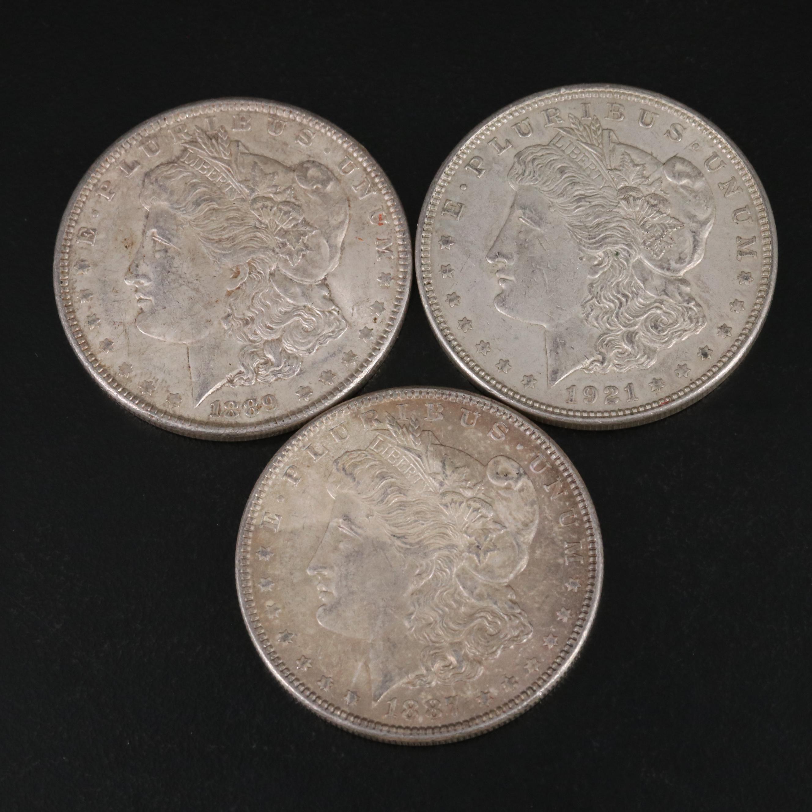 Nineteen Morgan and Peace Silver Dollars