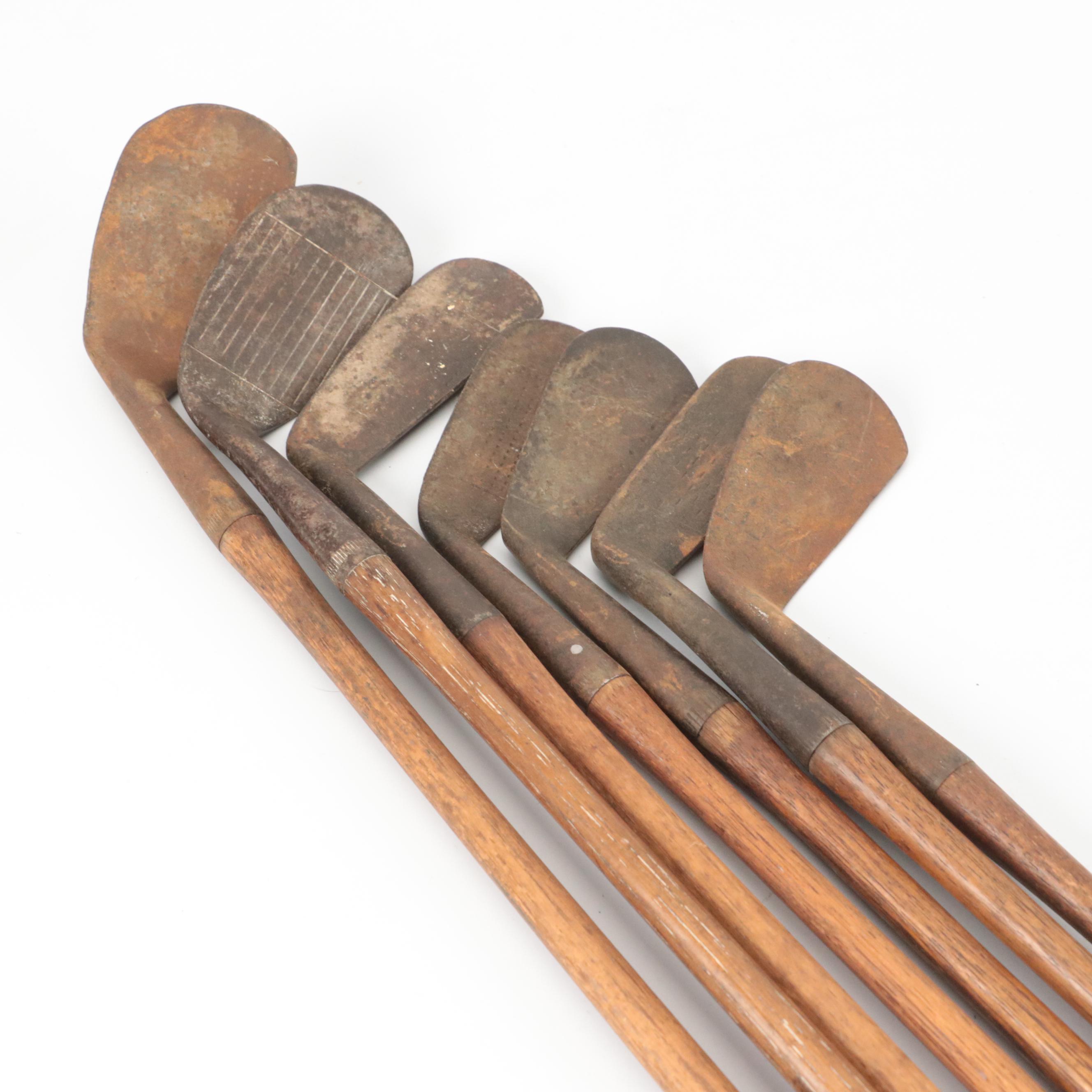 Seven Leather-Wrapped Hickory Shaft Golf Clubs, Including Spalding "Kro-Flite"