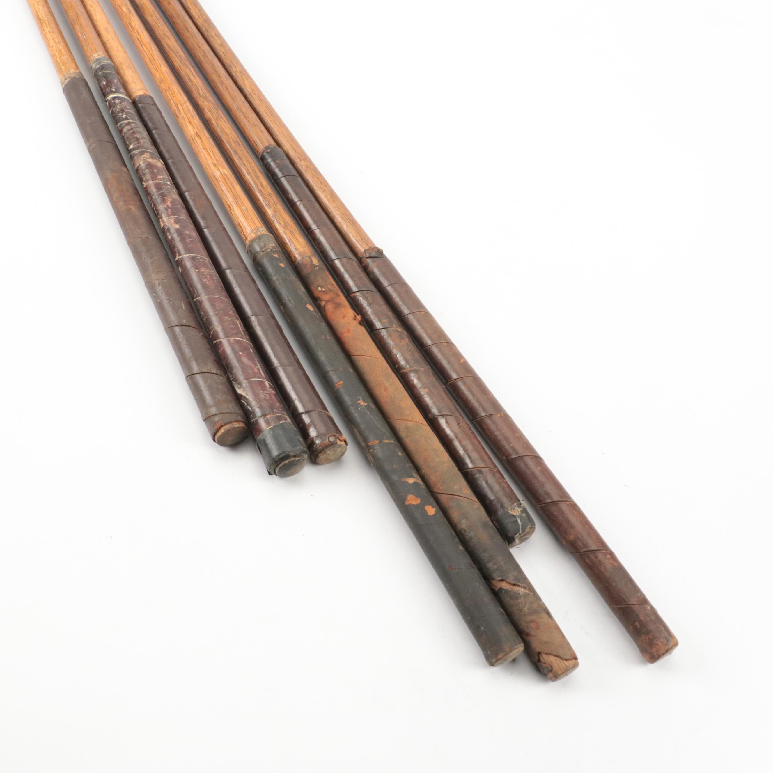 Seven Leather-Wrapped Hickory Shaft Golf Clubs, Including Spalding "Kro-Flite"