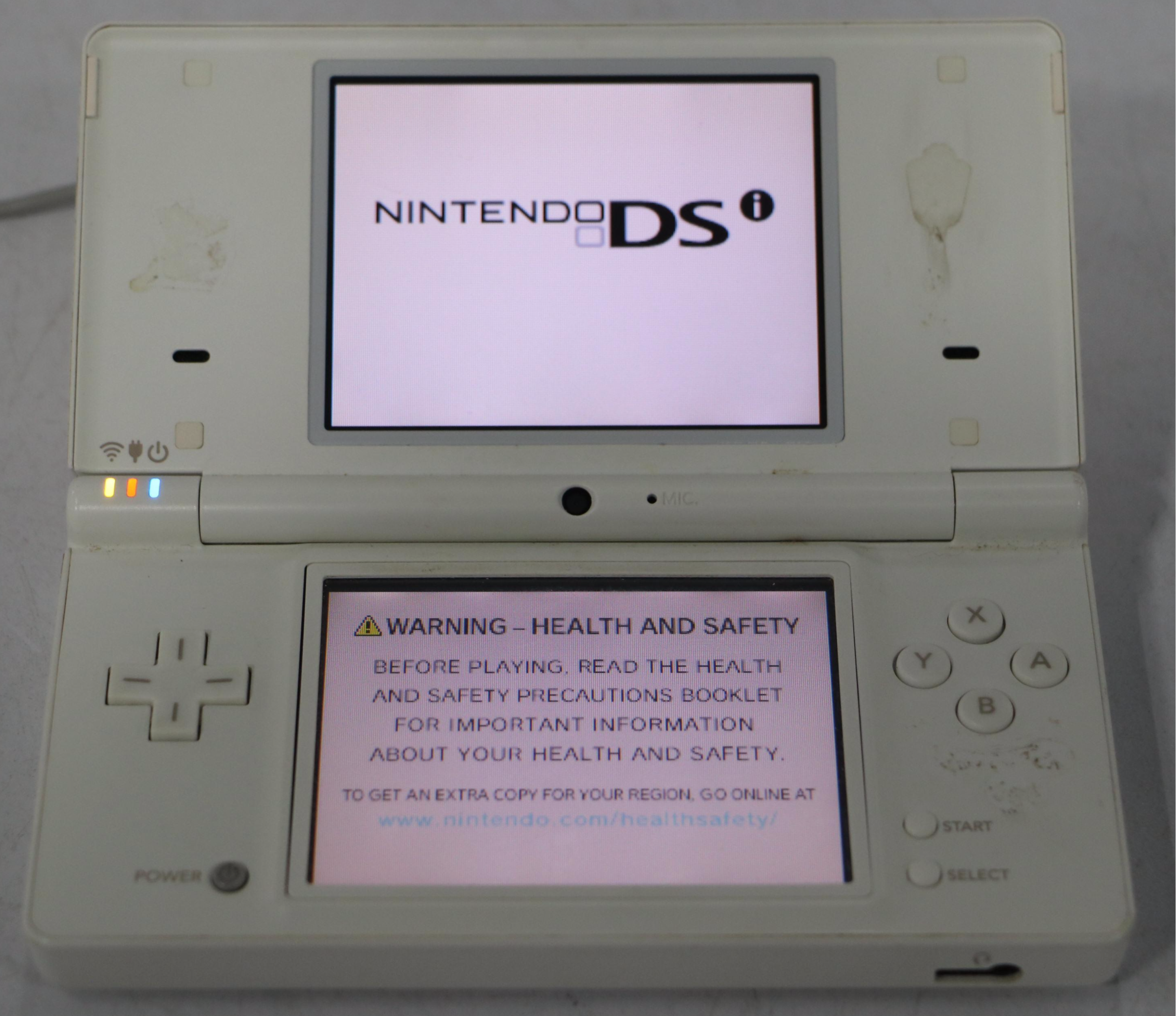 Nintendo DS Game Console with Sony Stereo Earbuds and More