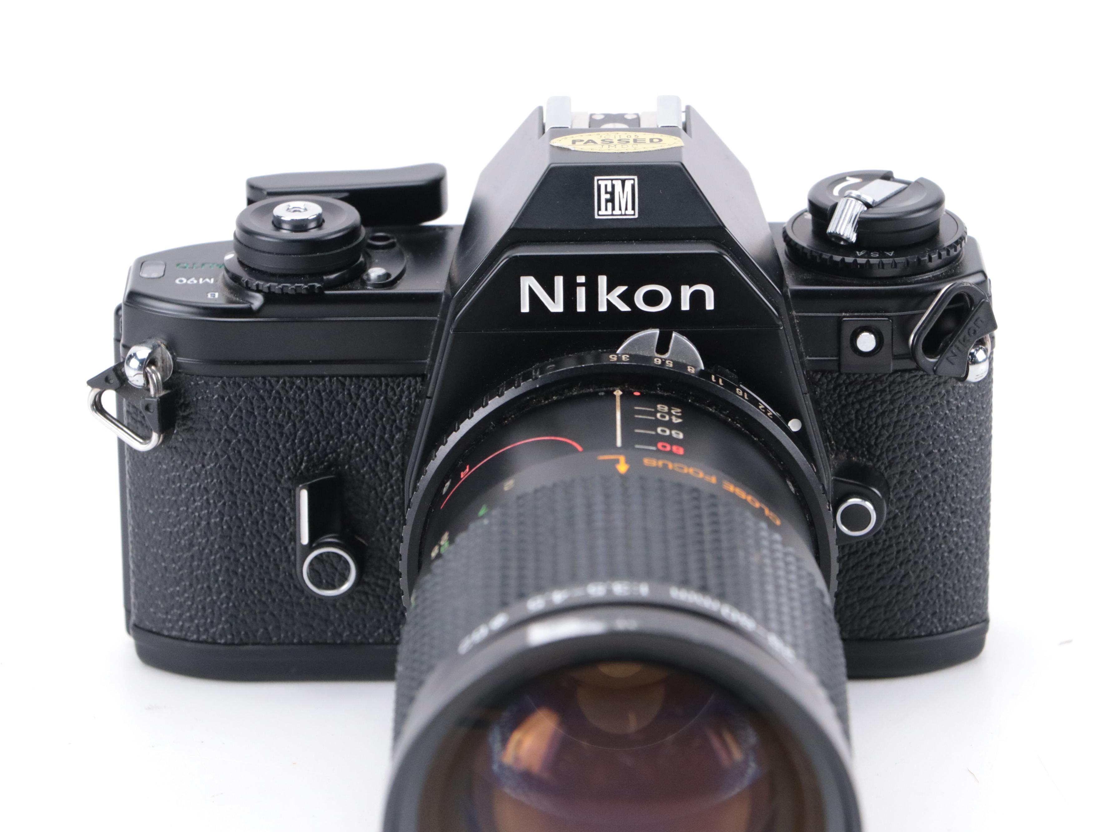 Nikon EM 35mm Camera with 135 and 205mm Lenses