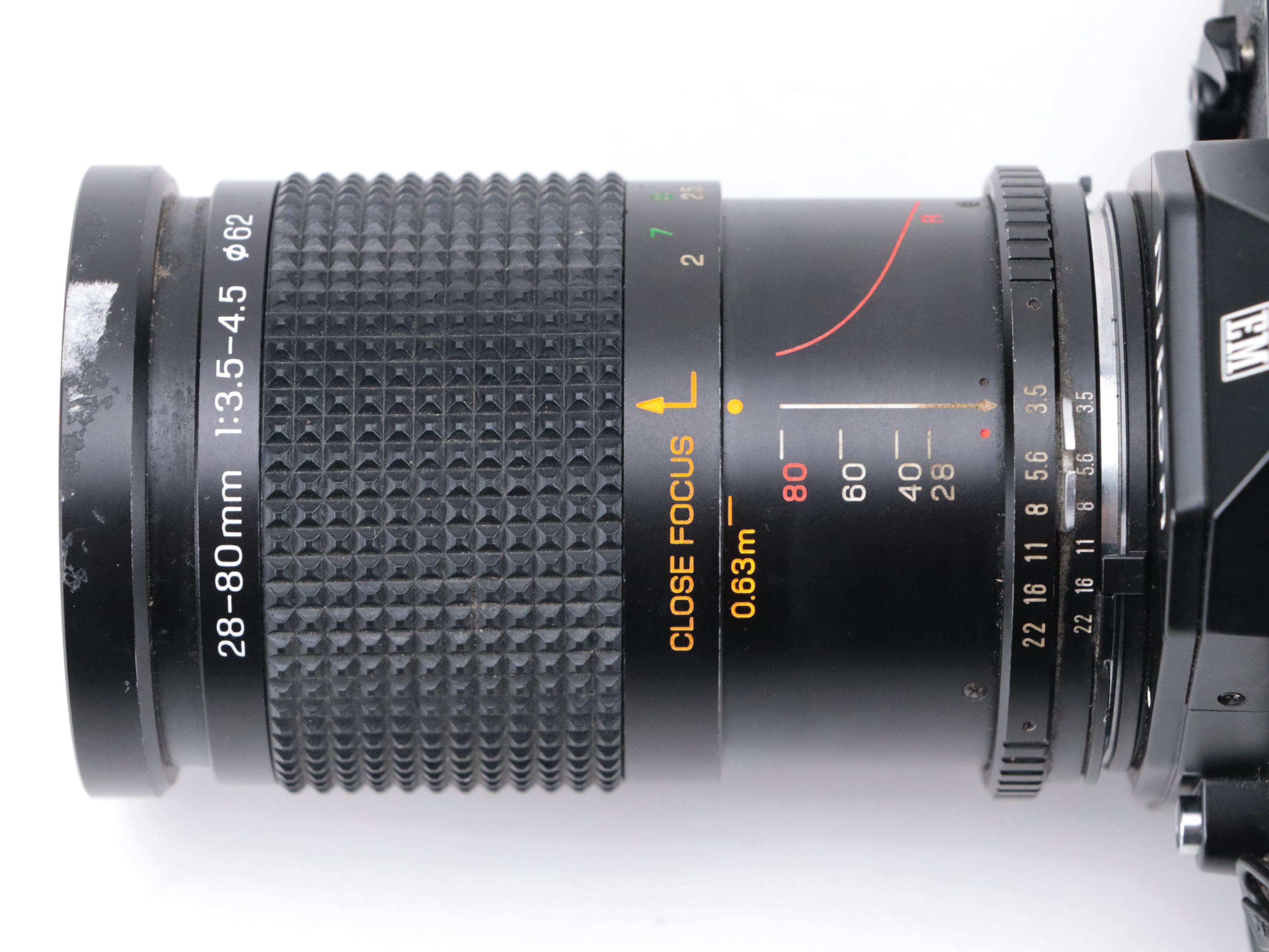 Nikon EM 35mm Camera with 135 and 205mm Lenses