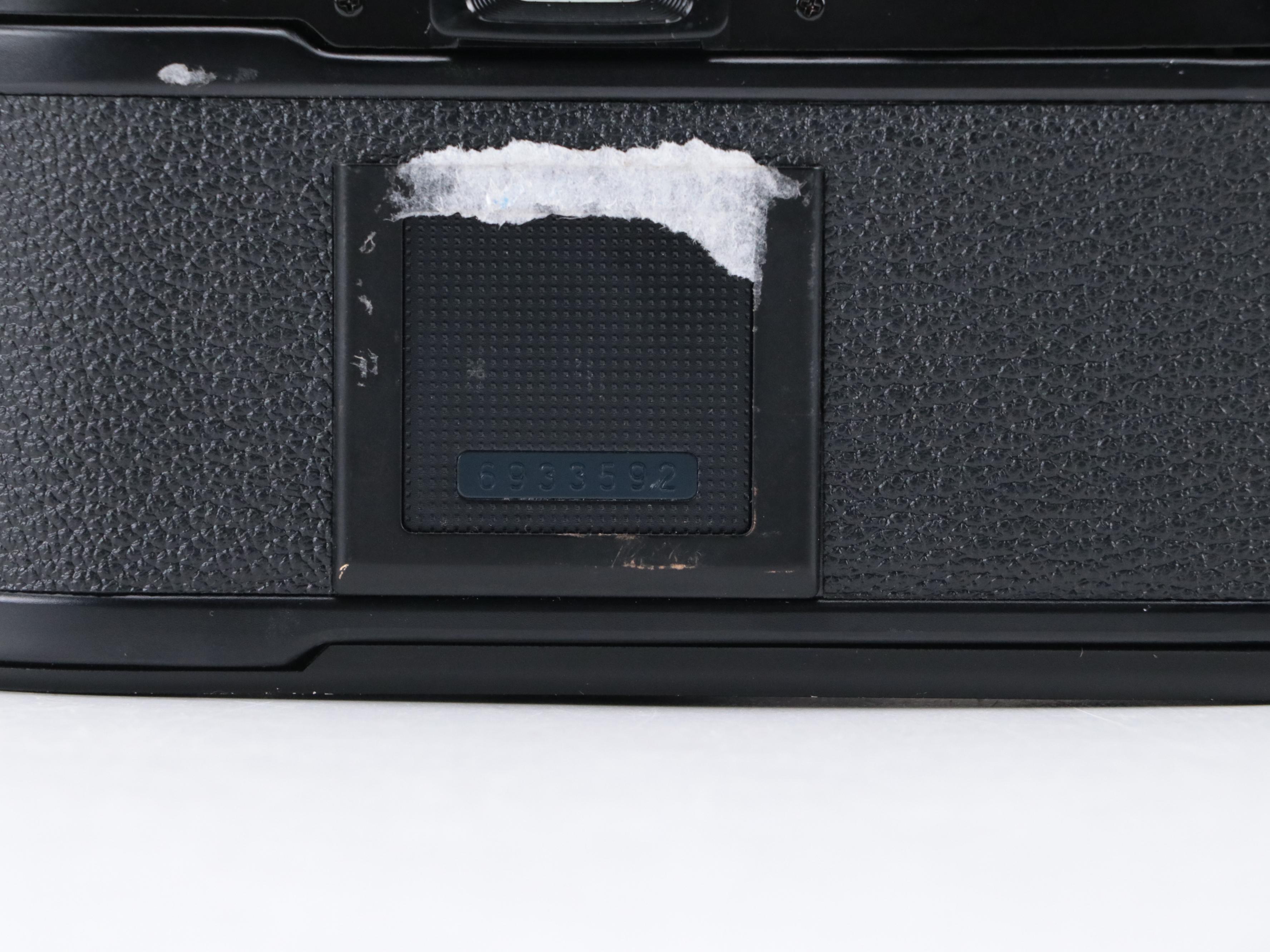 Nikon EM 35mm Camera with 135 and 205mm Lenses