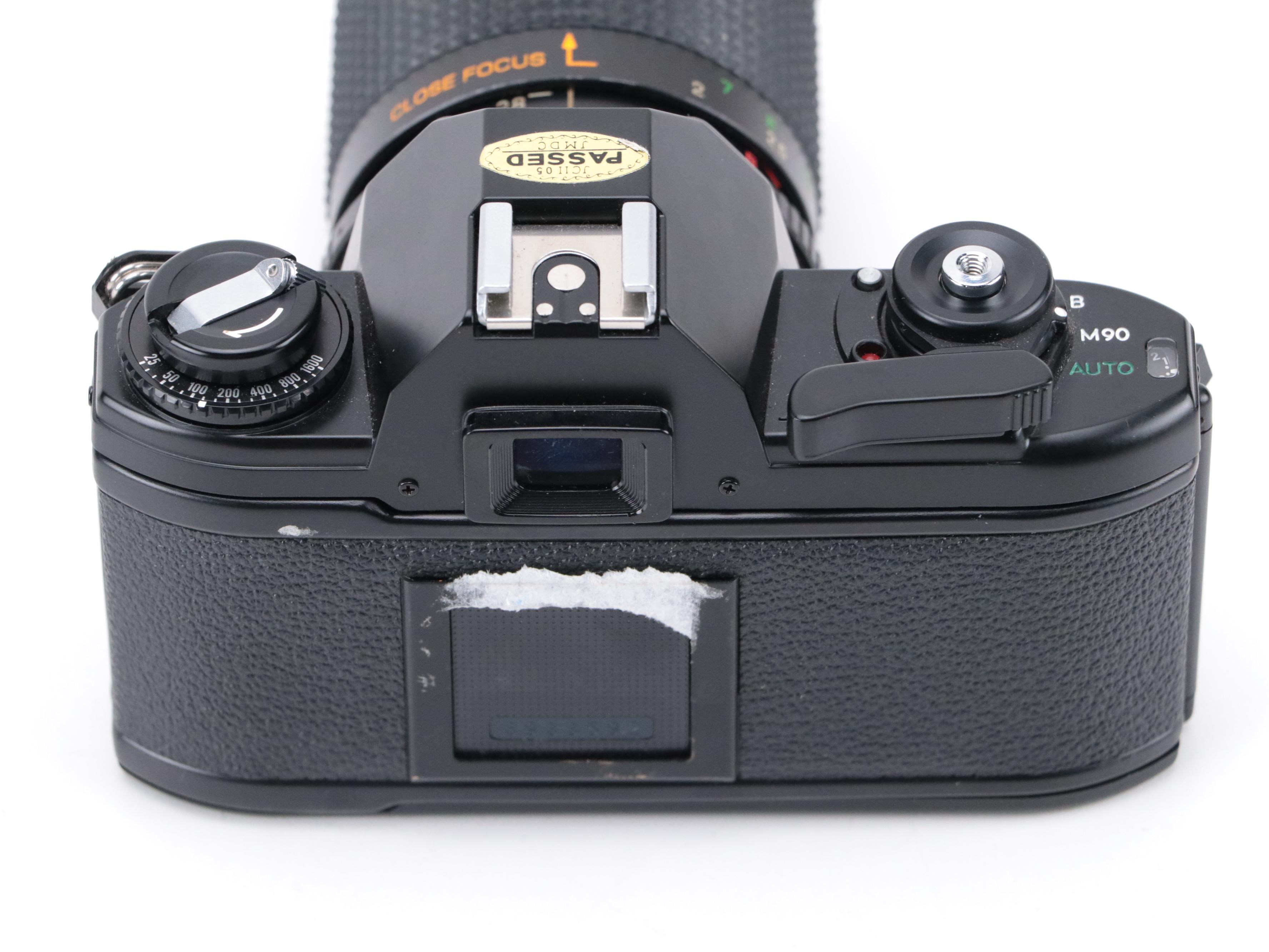 Nikon EM 35mm Camera with 135 and 205mm Lenses