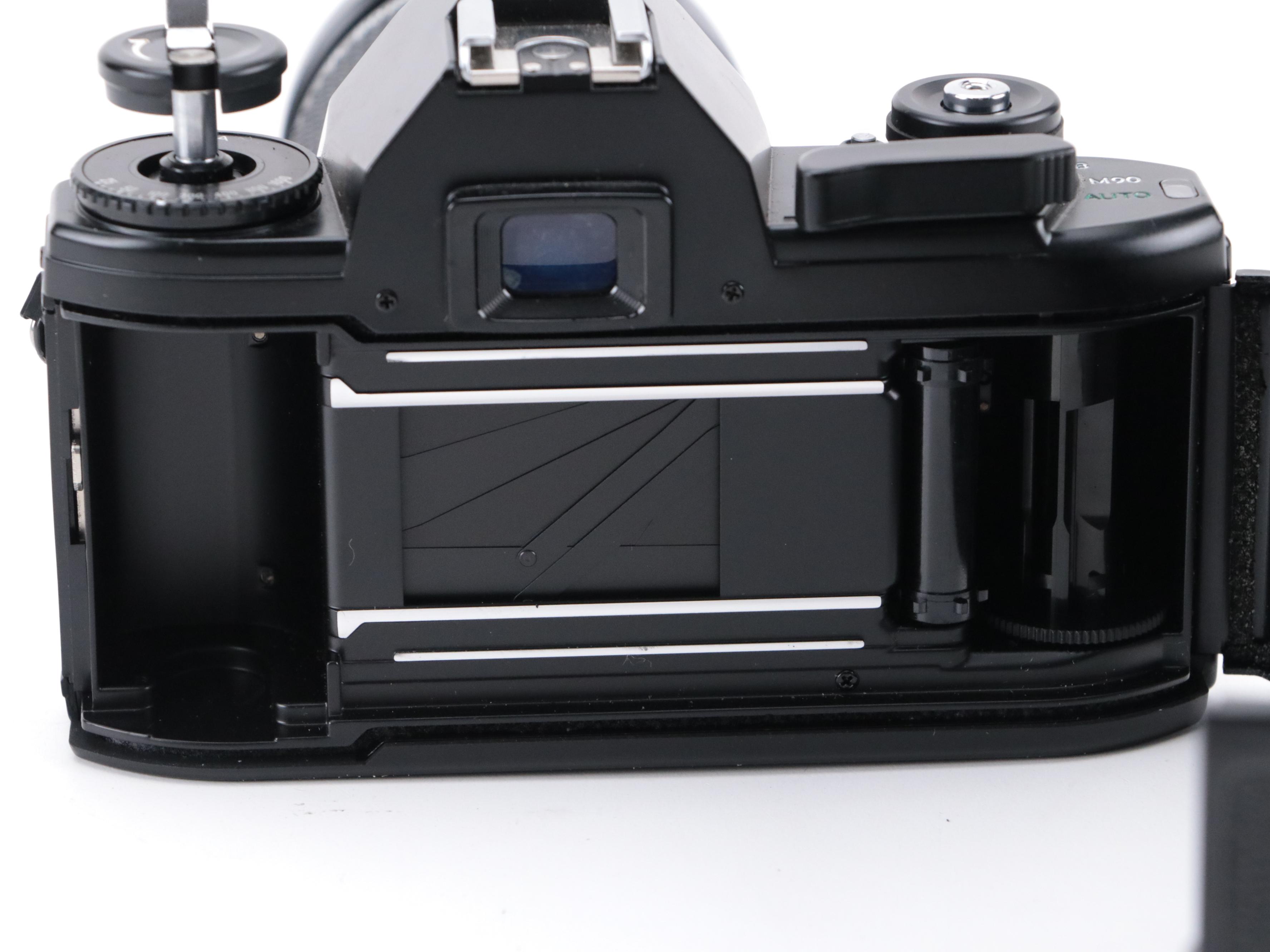 Nikon EM 35mm Camera with 135 and 205mm Lenses