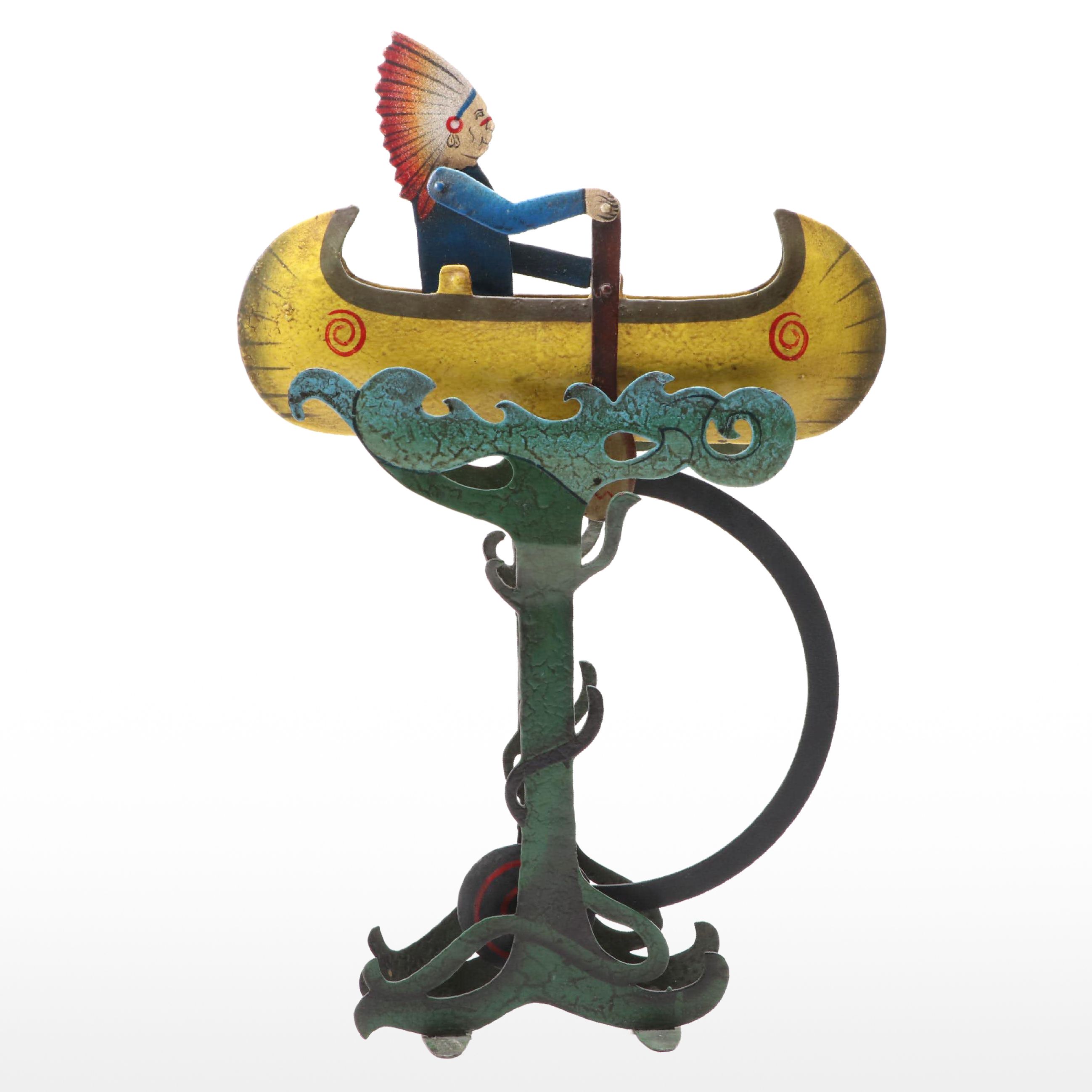 Folk Art Style Metal Native American in Canoe Kinetic Pendulum Sculpture