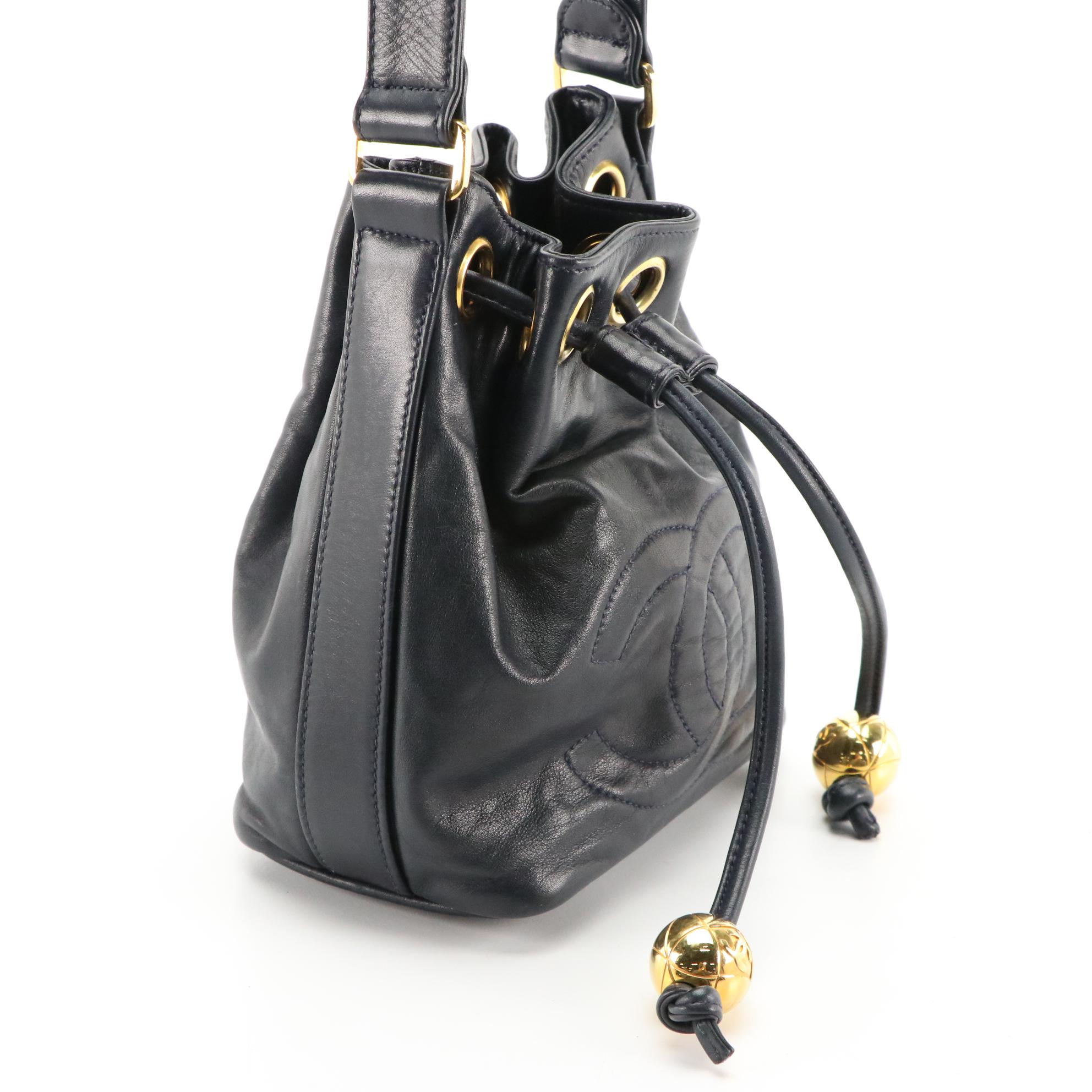 Chanel CC Mini Drawstring Bucket Bag in Navy Lambskin Leather with Zip Pouch