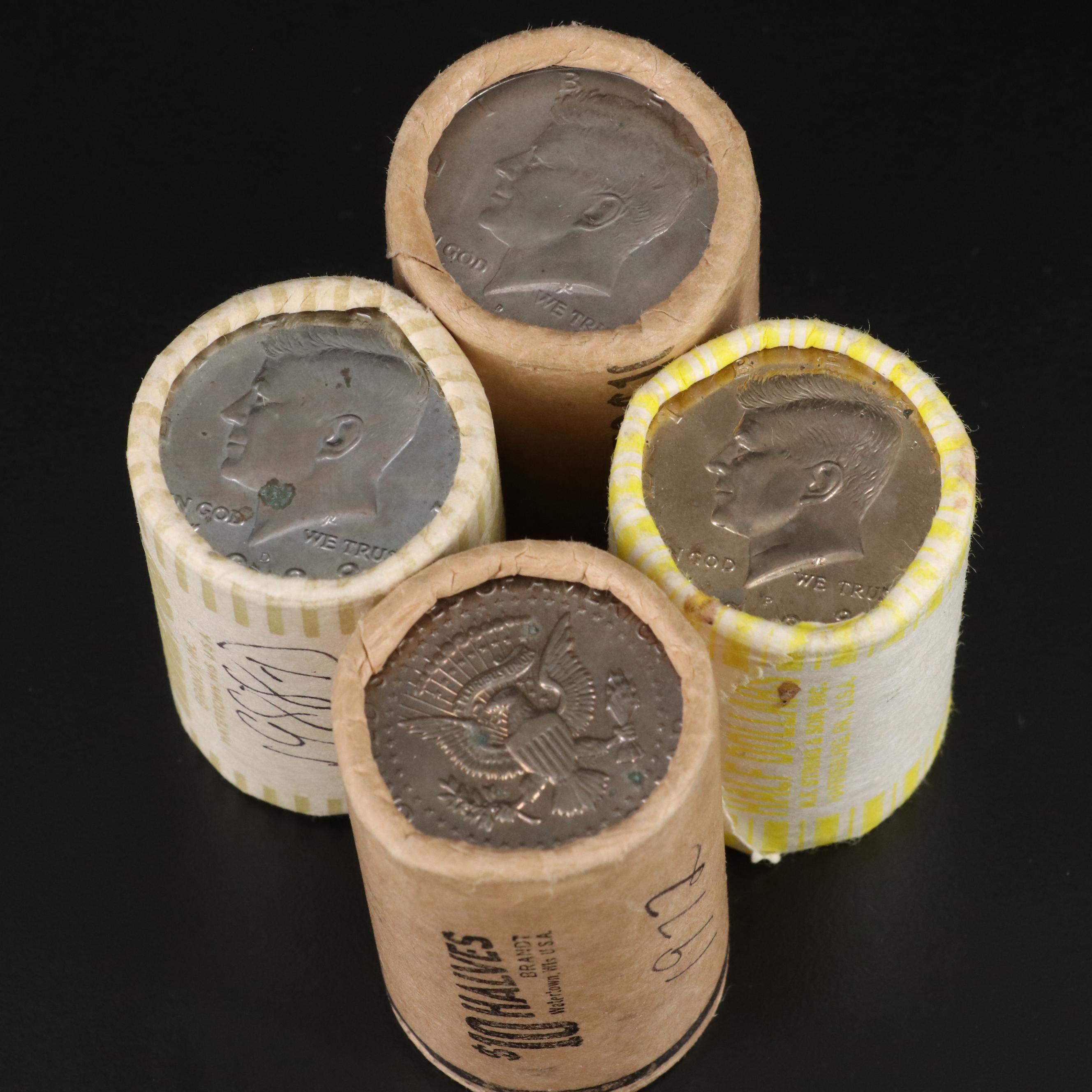Four Uncirculated Rolls of Kennedy Half Dollars