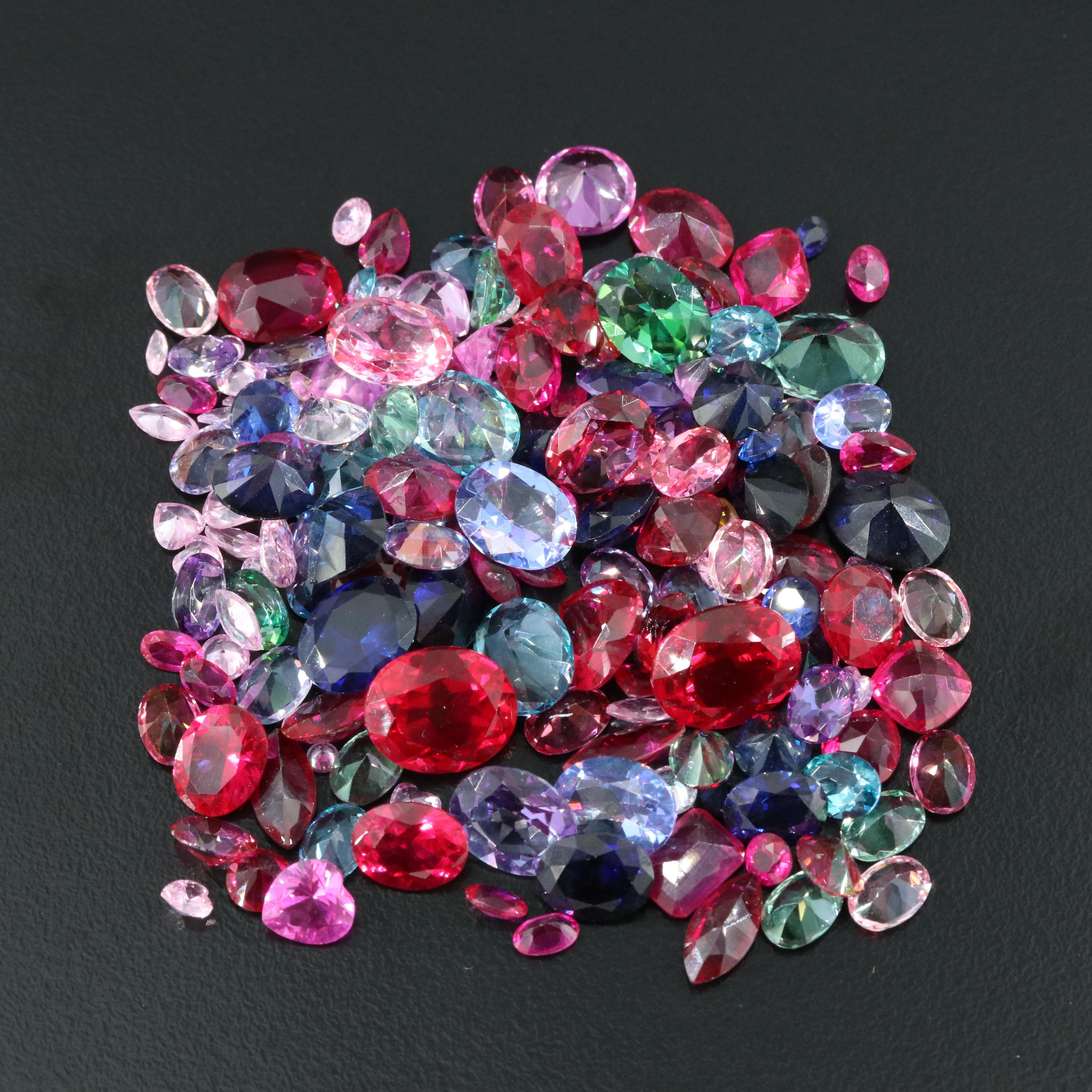 Loose 181.02 CTW Ruby, Sapphire, Topaz, and Gemstone Lot