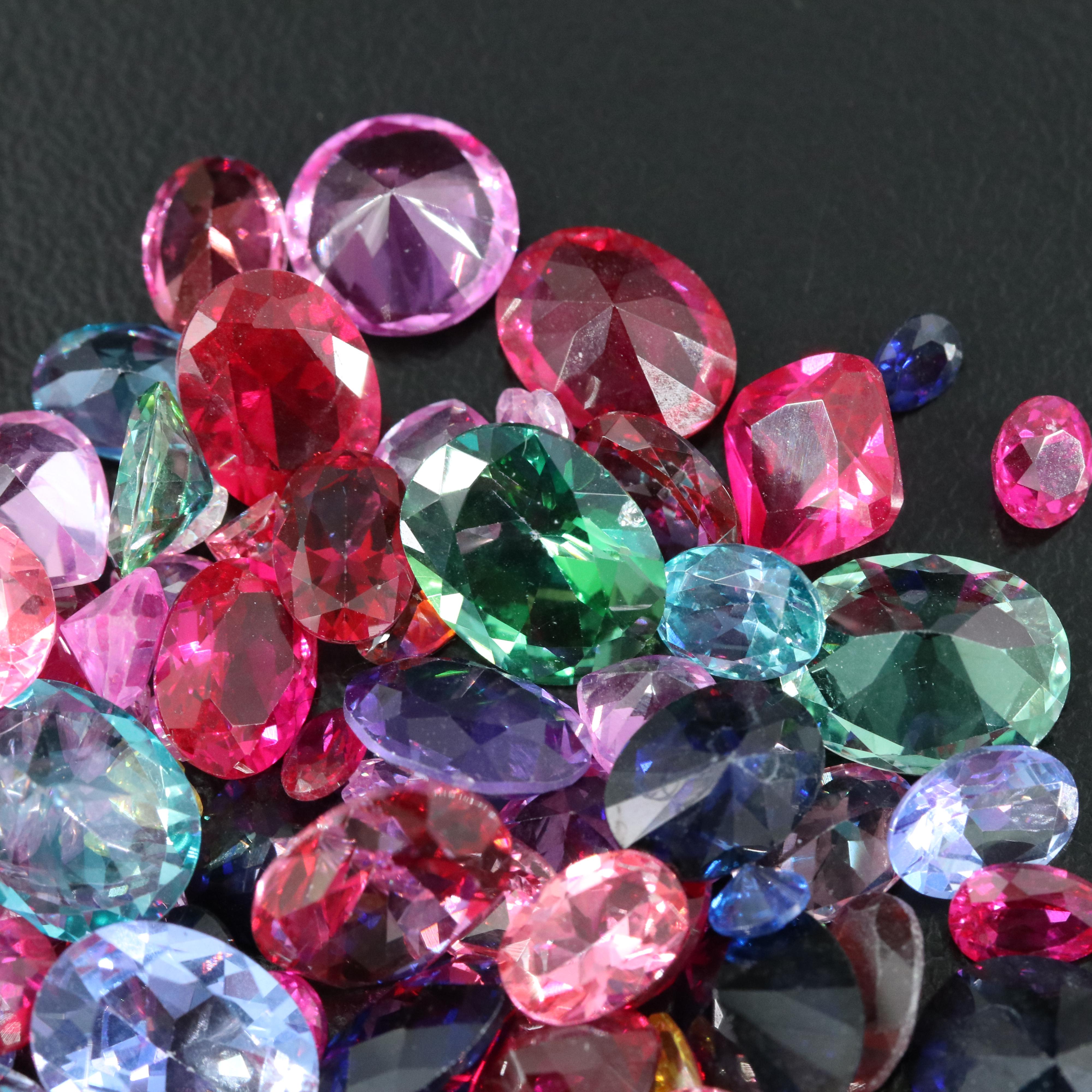 Loose 181.02 CTW Ruby, Sapphire, Topaz, and Gemstone Lot