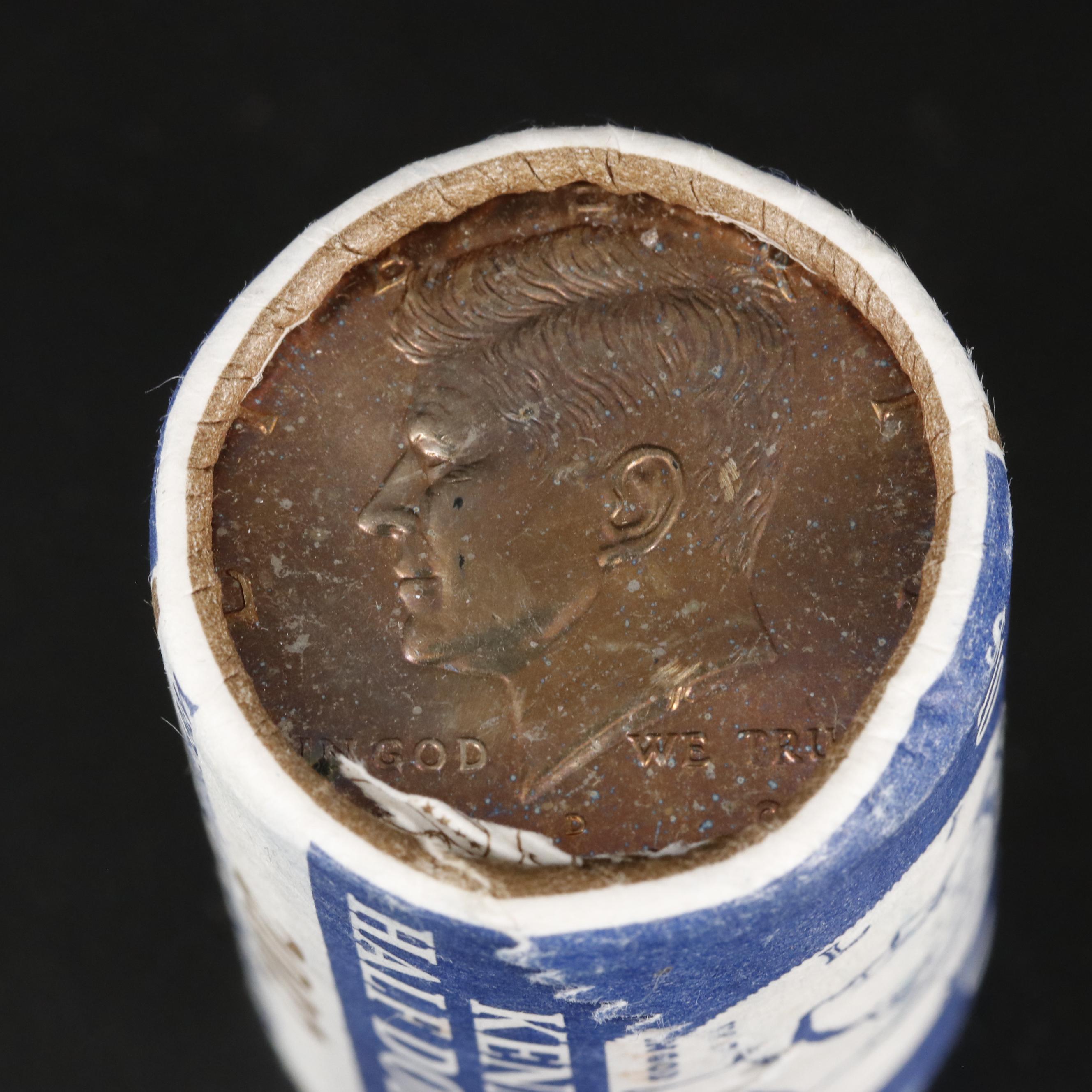 Four Uncirculated Rolls of Kennedy Half Dollars