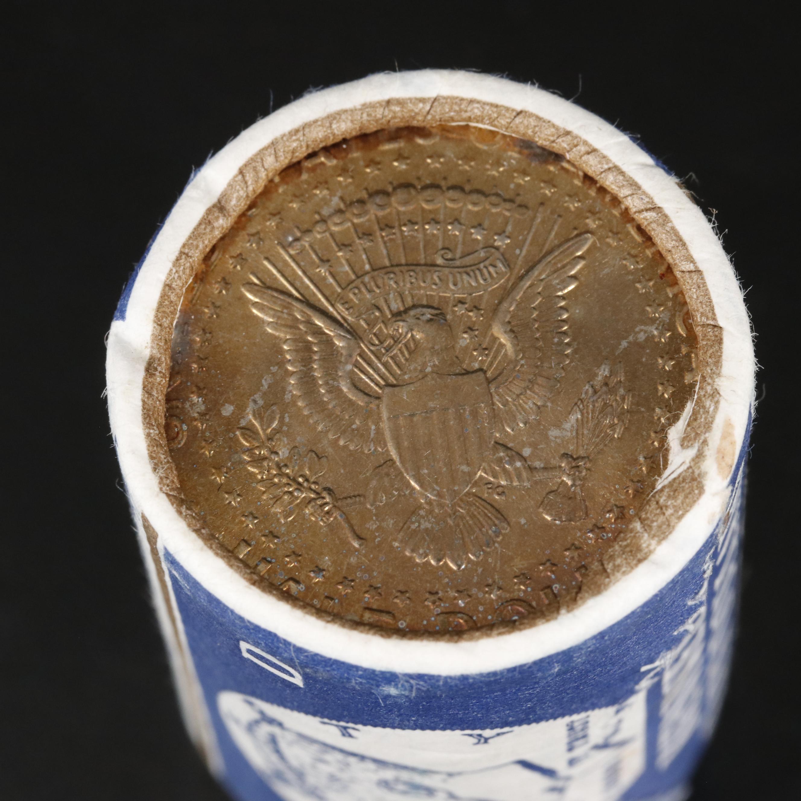 Four Uncirculated Rolls of Kennedy Half Dollars